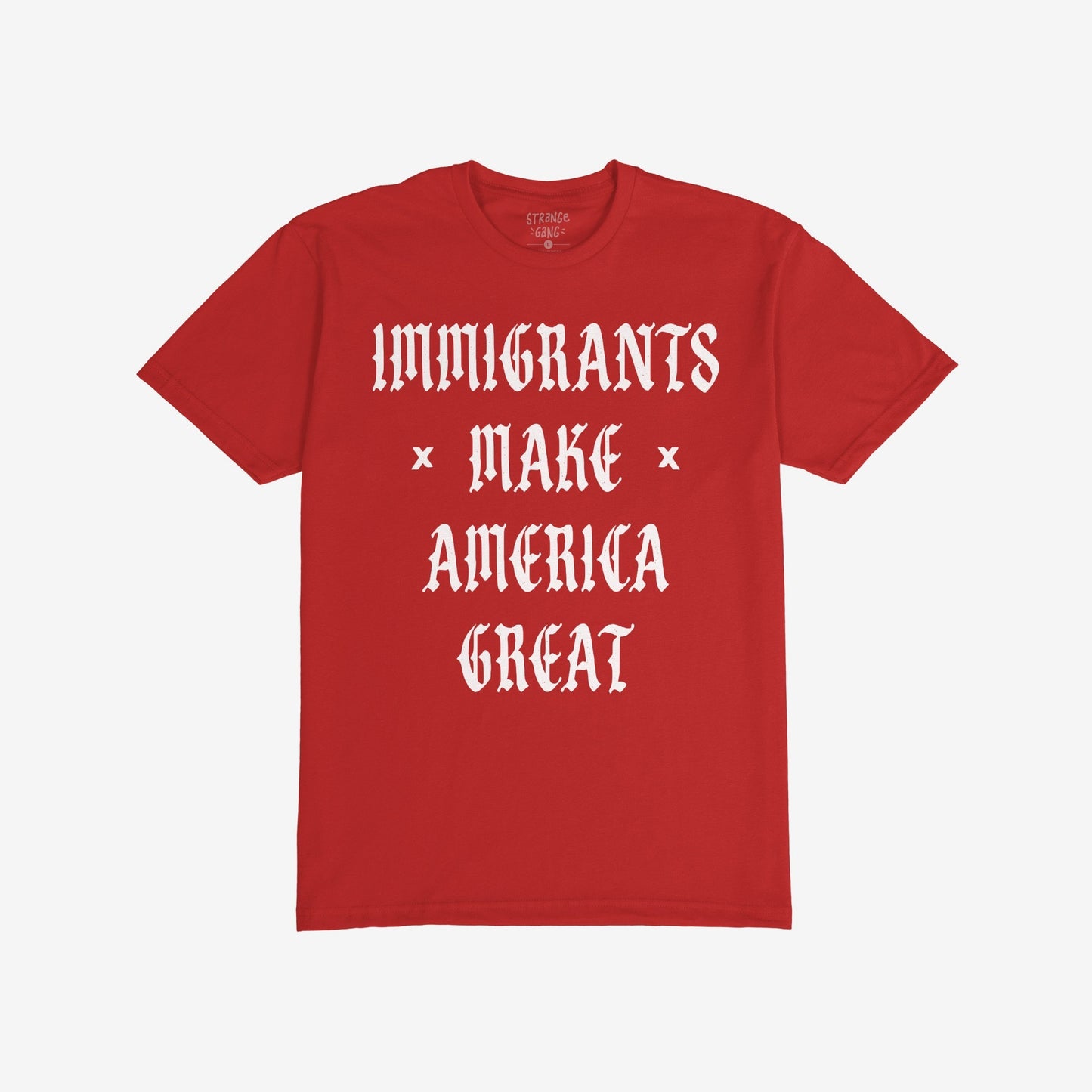 The Immigrants Make America Great T-shirt features bold, white old-English lettering on a red fabric, conveying a powerful statement against xenophobia and supporting immigrant rights.