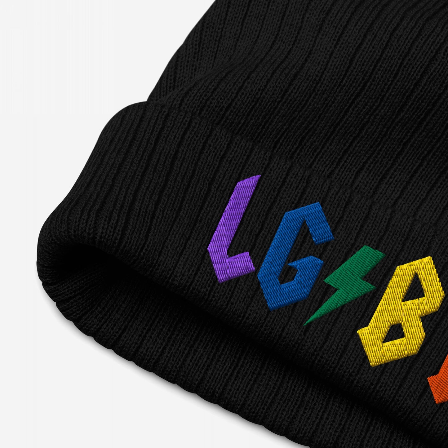 Black knit beanie featuring colorful rainbow embroidery and a lightning bolt design, titled LGBTQ Rocks Hat.