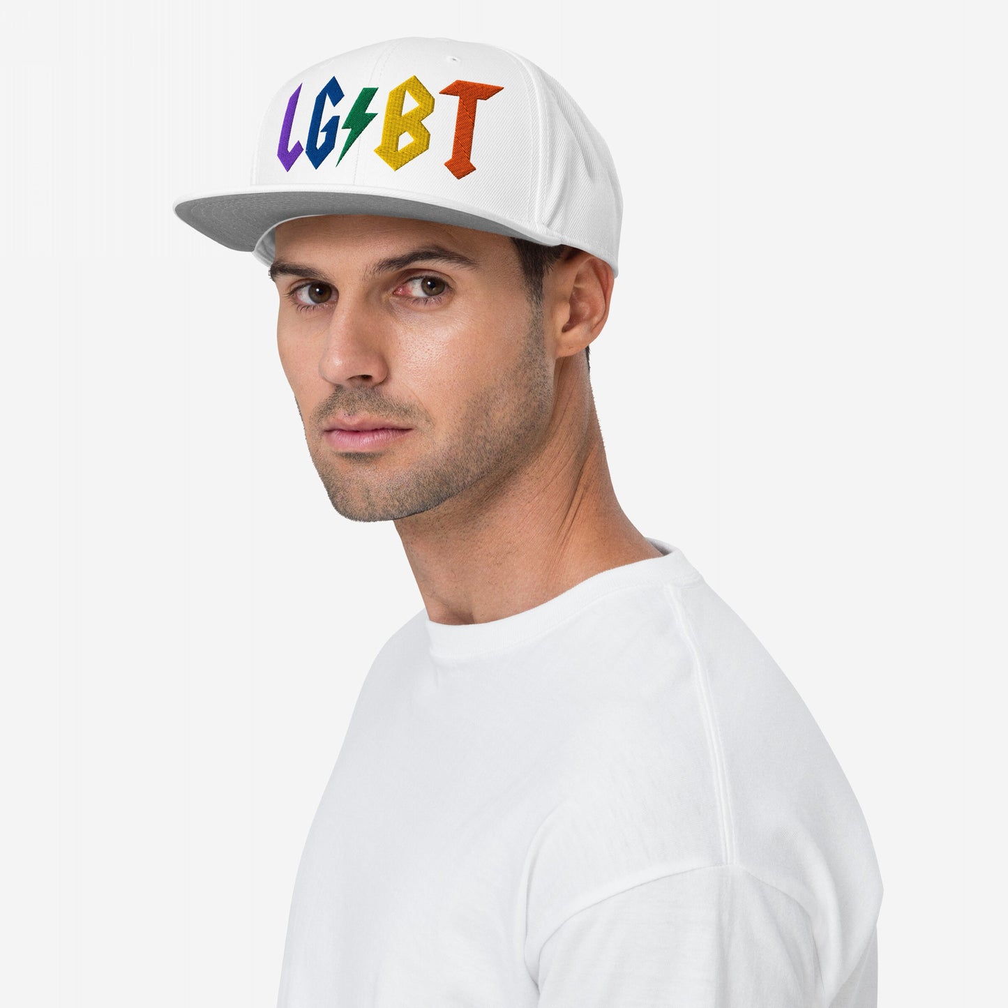 Man wearing white snapback hat with rainbow embroidered LGBT lightning bolt on front, LGBTQ Rocks Hat.