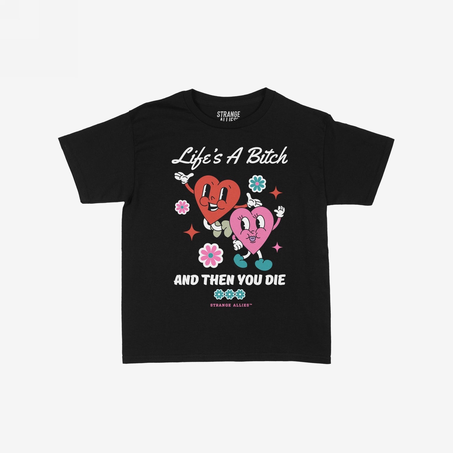 Life's A Bitch T-shirt features retro-cartoon graphics of dancing hearts and flowers with the slogans Life’s A Bitch and And Then You Die, embodying cheerful chaos and deadpan realism.