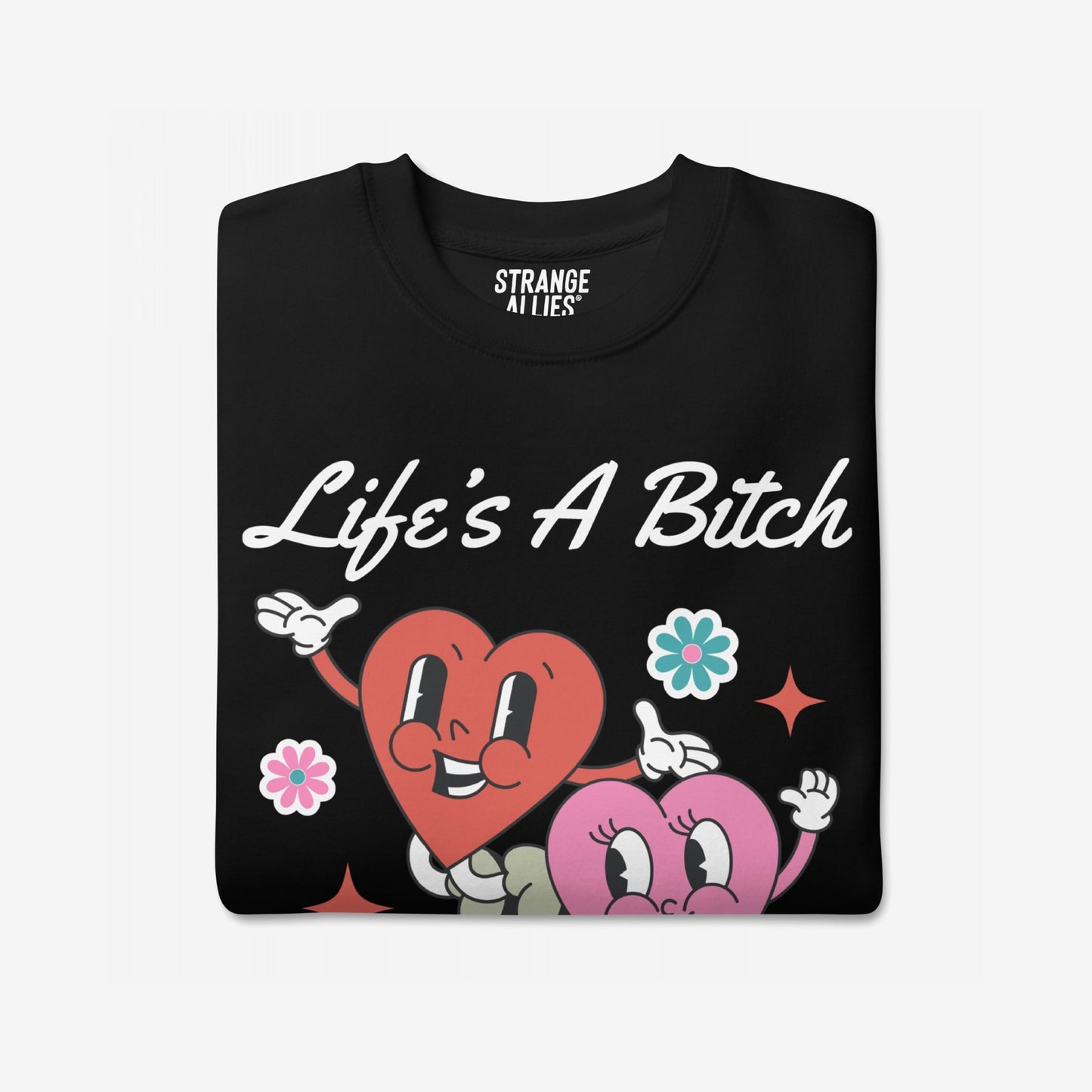 Life's A Bitch Hoodie & Sweatshirt features a retro-cartoon design with two smiling hearts and the slogan, delivering a bold, honest statement. Perfect for those embracing life's absurdity with style.