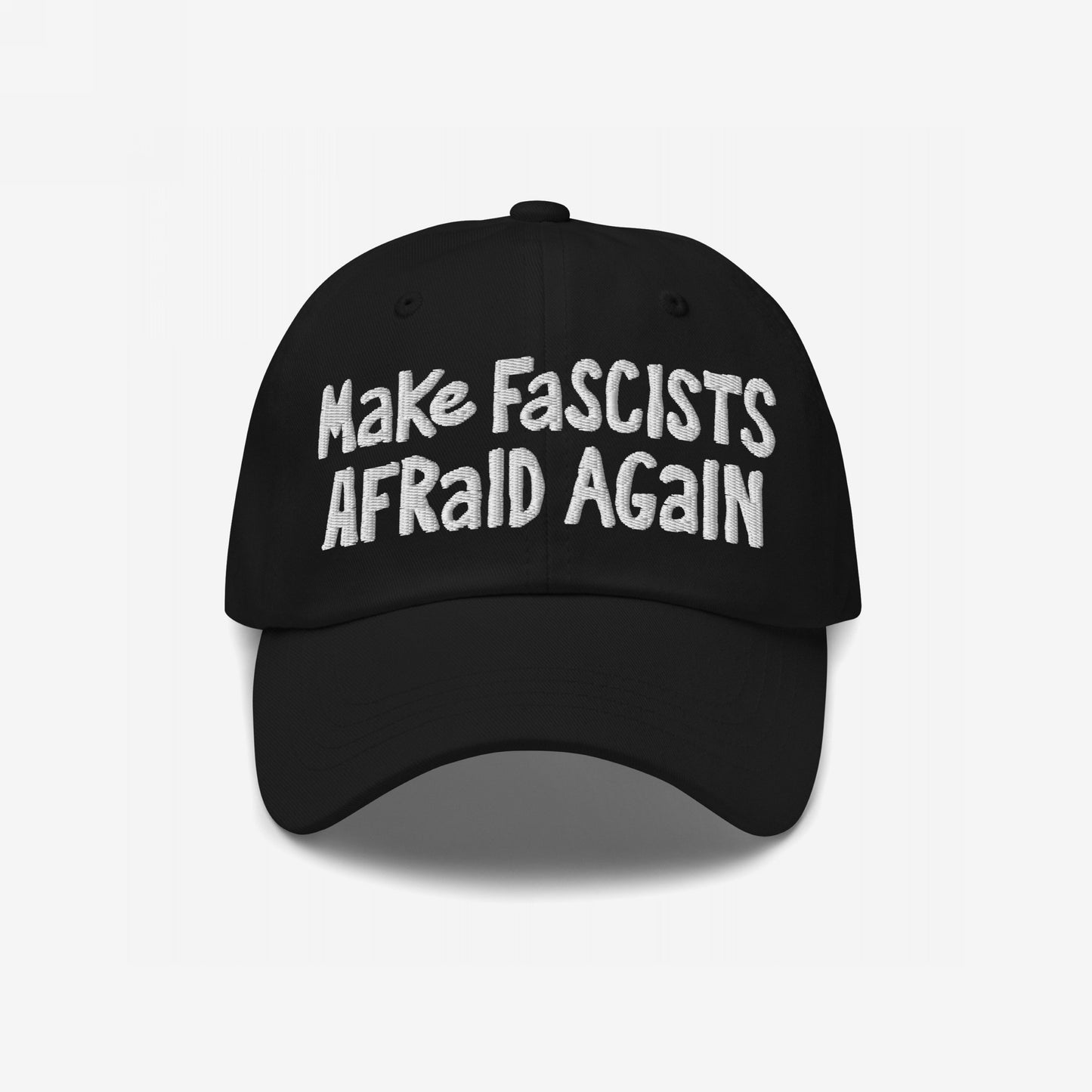 Black baseball cap with bold white embroidery reading “Make Fascists Afraid Again,” reflecting unapologetic resistance. The cap embodies a rebellious spirit with its unpolished, hand-drawn design, symbolizing defiance.
