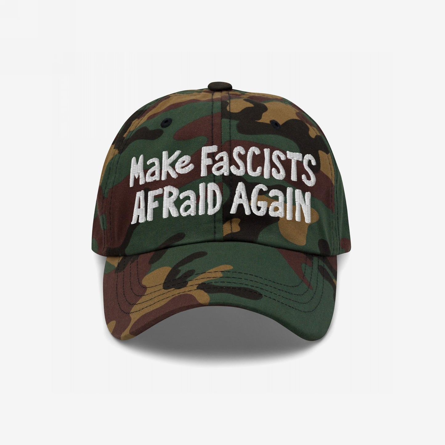 Camouflage-print baseball cap with Make Fascists Afraid Again in bold, white embroidery, capturing an unapologetic stance against fascism, reflecting resistance and activism through its hand-drawn style and easy fit.