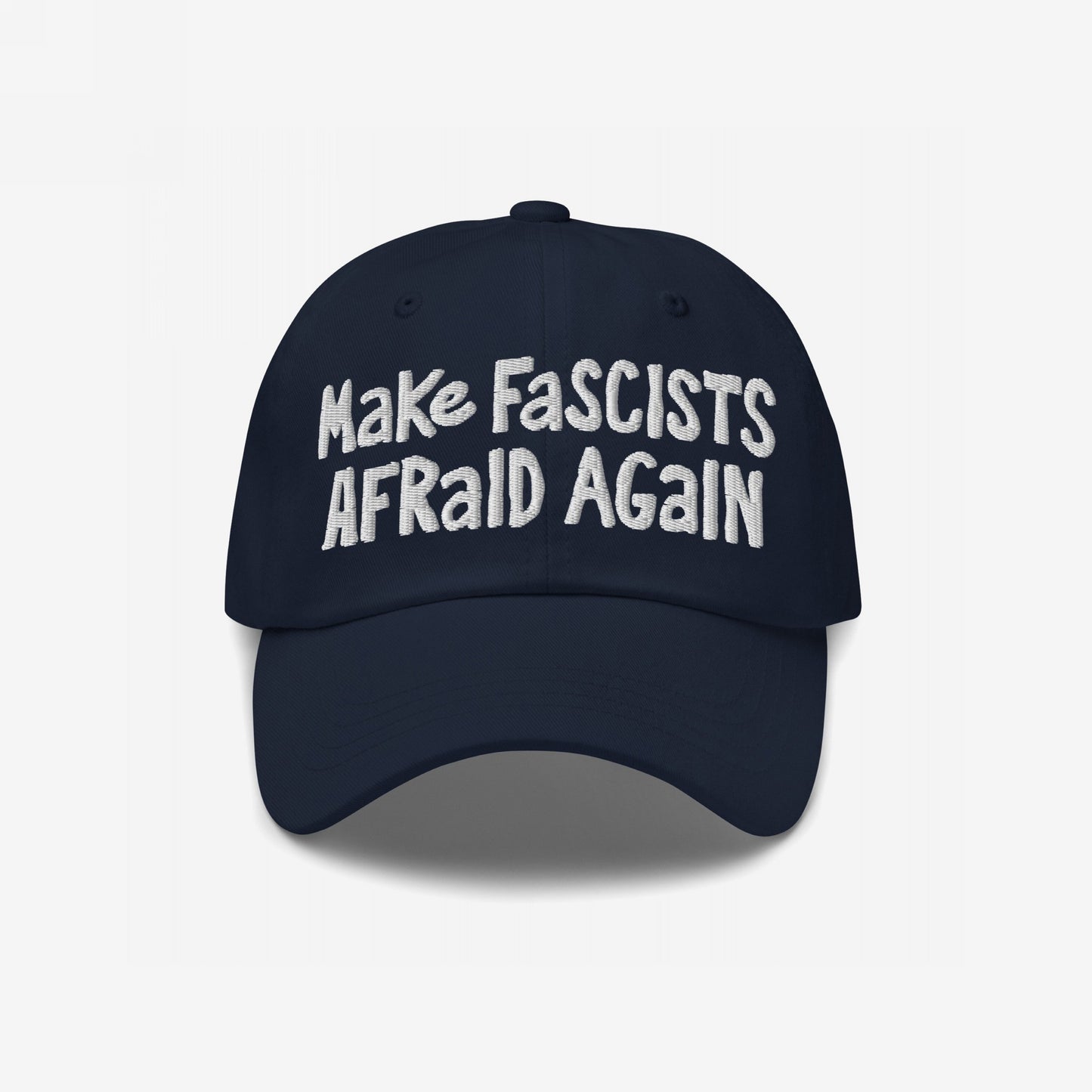 Make Fascists Afraid Again Hat with bold, white embroidered text on a dark navy-blue cap, embodying unapologetic resistance and activism. Available in multiple styles, supporting Amnesty International.