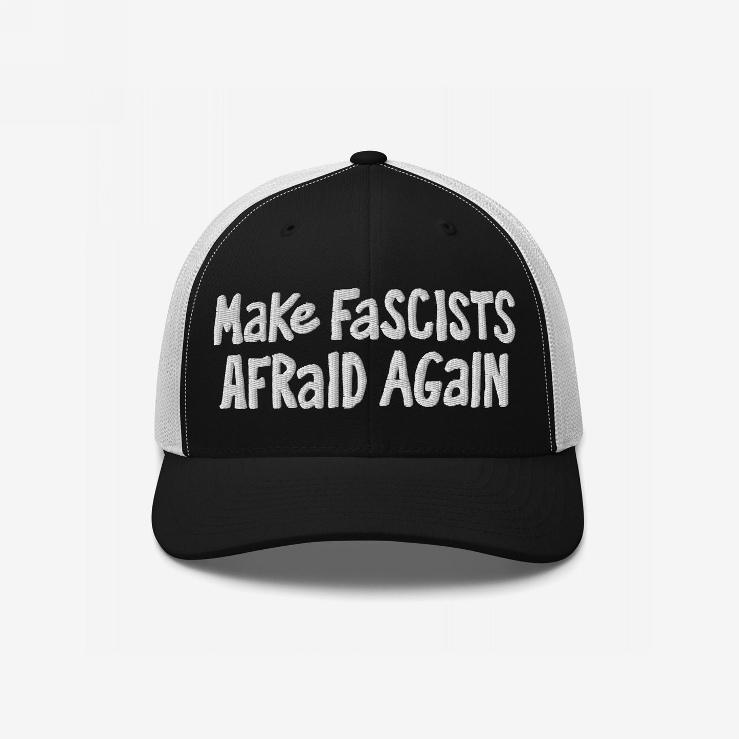 The Make Fascists Afraid Again hat features bold, hand-lettered embroidery on a black-and-white trucker-style cap, embodying unapologetic resistance with its striking, unpolished design.