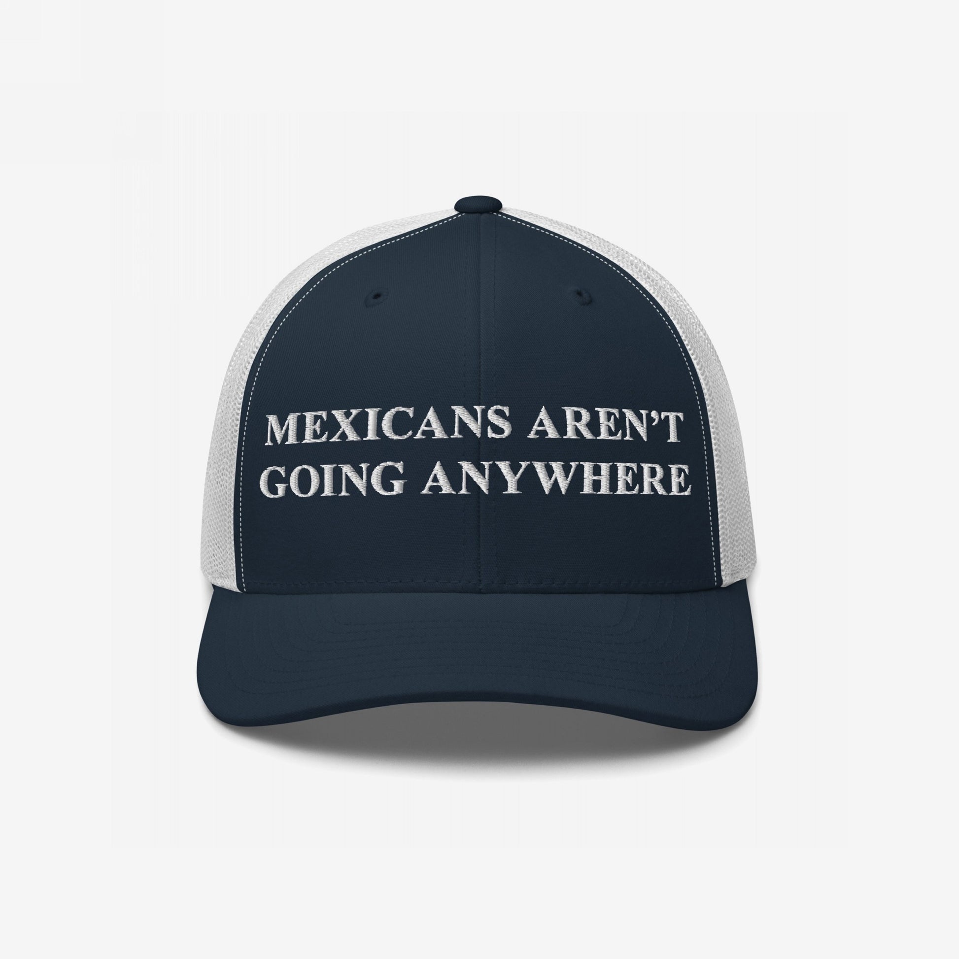 Navy-blue and white mesh-back trucker hat with Mexicans Aren’t Going Anywhere embroidered, symbolizing resistance and pride. Reflects anti-racism and equality, aligning with the store's advocacy ethos.