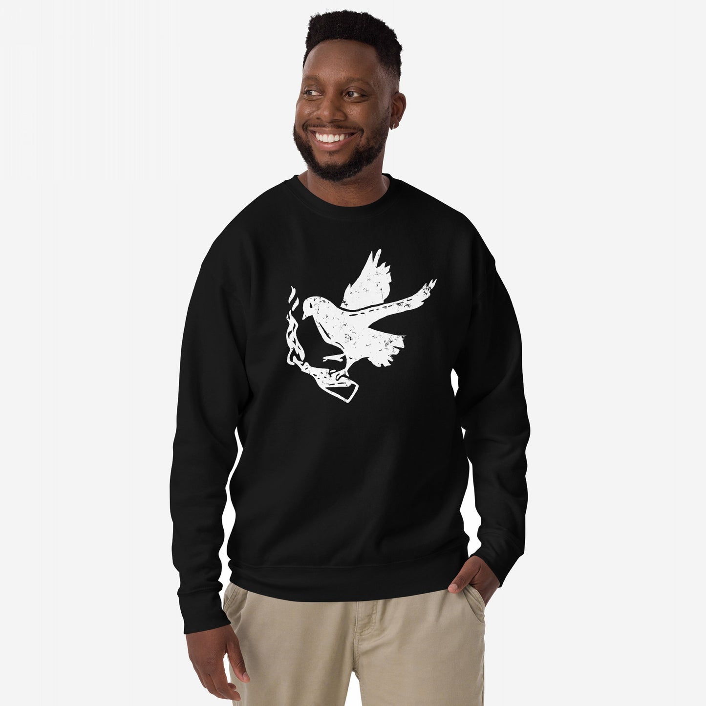 Molotov Messenger Hoodie & Sweatshirt: Man modeling a black crew-neck with distressed white dove graphic clutching a smoking gun, embodying subversive protest spirit and peace through power.