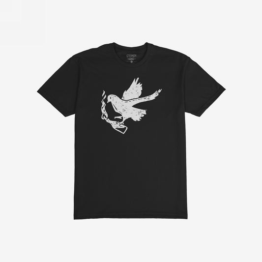 Black Molotov Messenger Shirt with a distressed white graphic of a bird clutching a smoking handgun, symbolizing defiant peace and activism. The collar reads “STRANGE + GANG.”