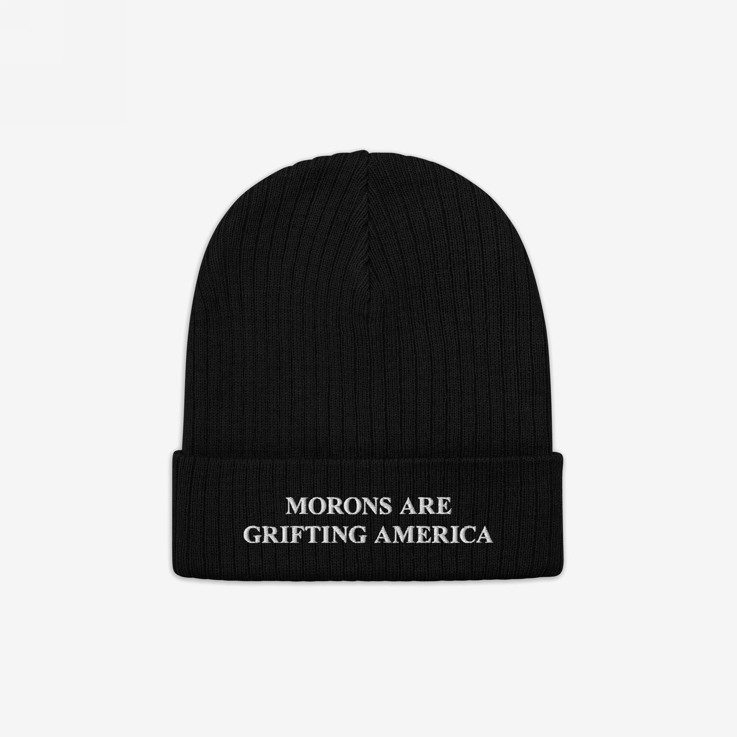 Black rib-knit beanie with folded cuff, featuring the slogan “MORONS ARE GRIFTING AMERICA” in white embroidery. This Morons Are Grifting America Hat embodies direct, unapologetic political commentary.