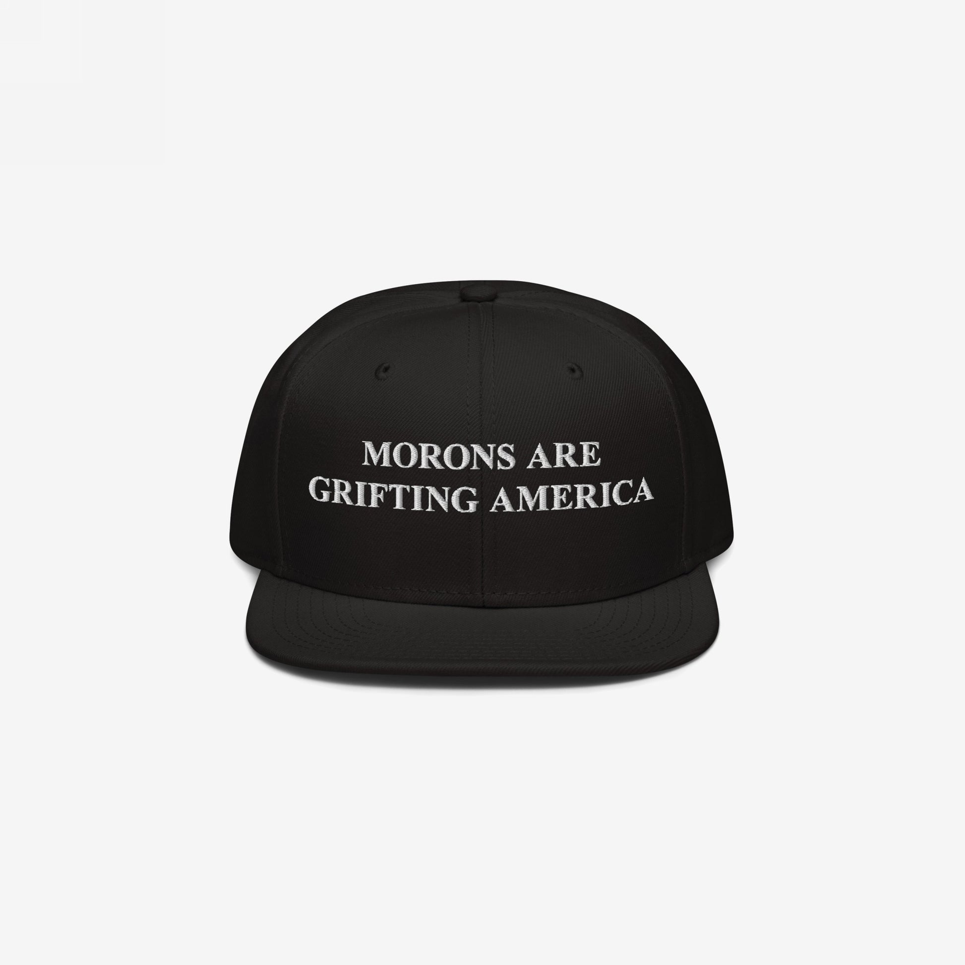 Black snapback hat with flat brim and white embroidered text "Morons Are Grifting America," a bold anti-MAGA message on structured headwear.