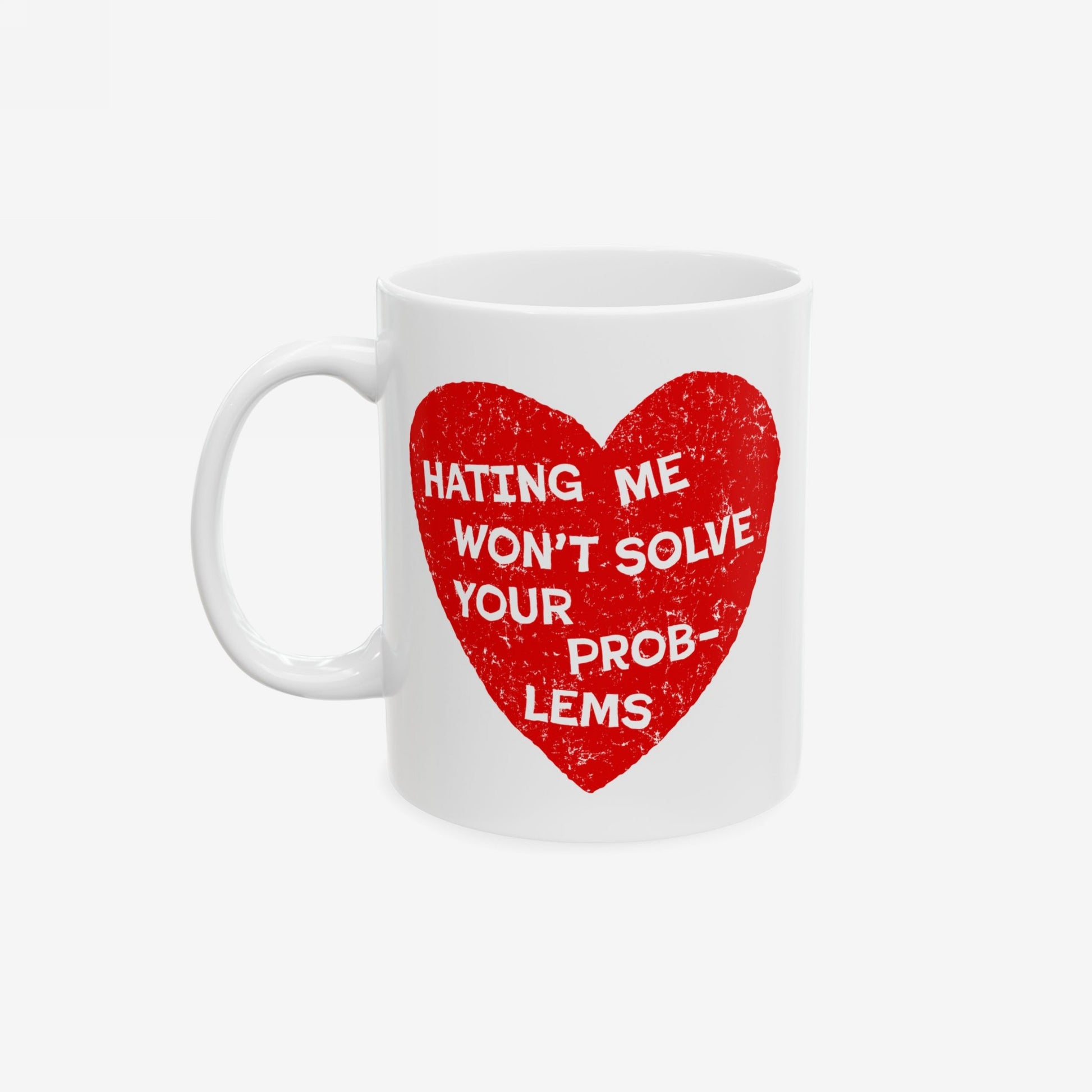 White ceramic No Hate Mug features a distressed red heart with bold white text: “HATING ME WON’T SOLVE YOUR PROBLEMS.” Ideal for activists and allies, supporting messages of empowerment and equality.