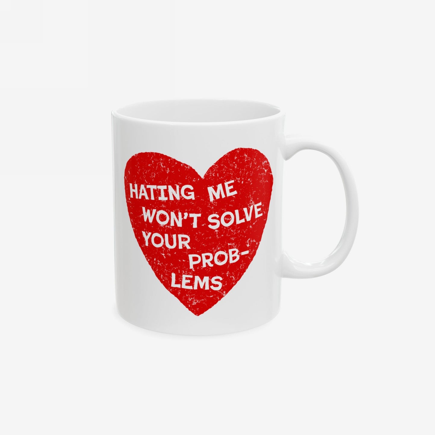 No Hate Mug featuring a distressed red heart with bold text, “HATING ME WON’T SOLVE YOUR PROBLEMS.” Ideal for activists and advocates, this ceramic mug embodies a strong stance against projection.