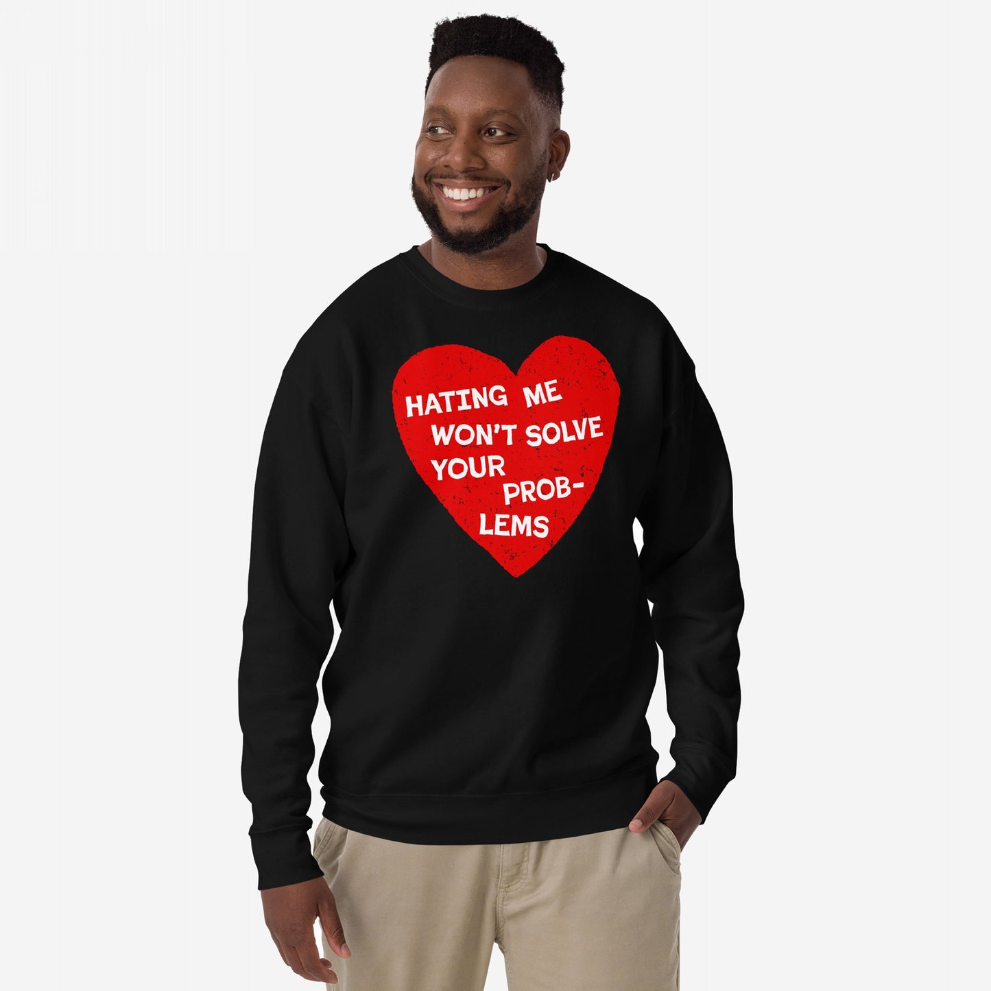 No Hate Hoodie & Sweatshirt features a striking red heart with the message HATING ME WON’T SOLVE YOUR PROBLEMS, worn by a smiling man, promoting equality and resistance.