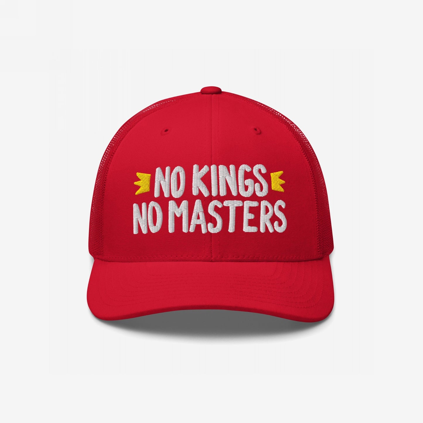 Front view of the No Kings No Masters red trucker hat featuring white embroidered text with yellow accents, symbolizing rebellion and defiance. Perfect for expressing anti-establishment sentiments with bold style.