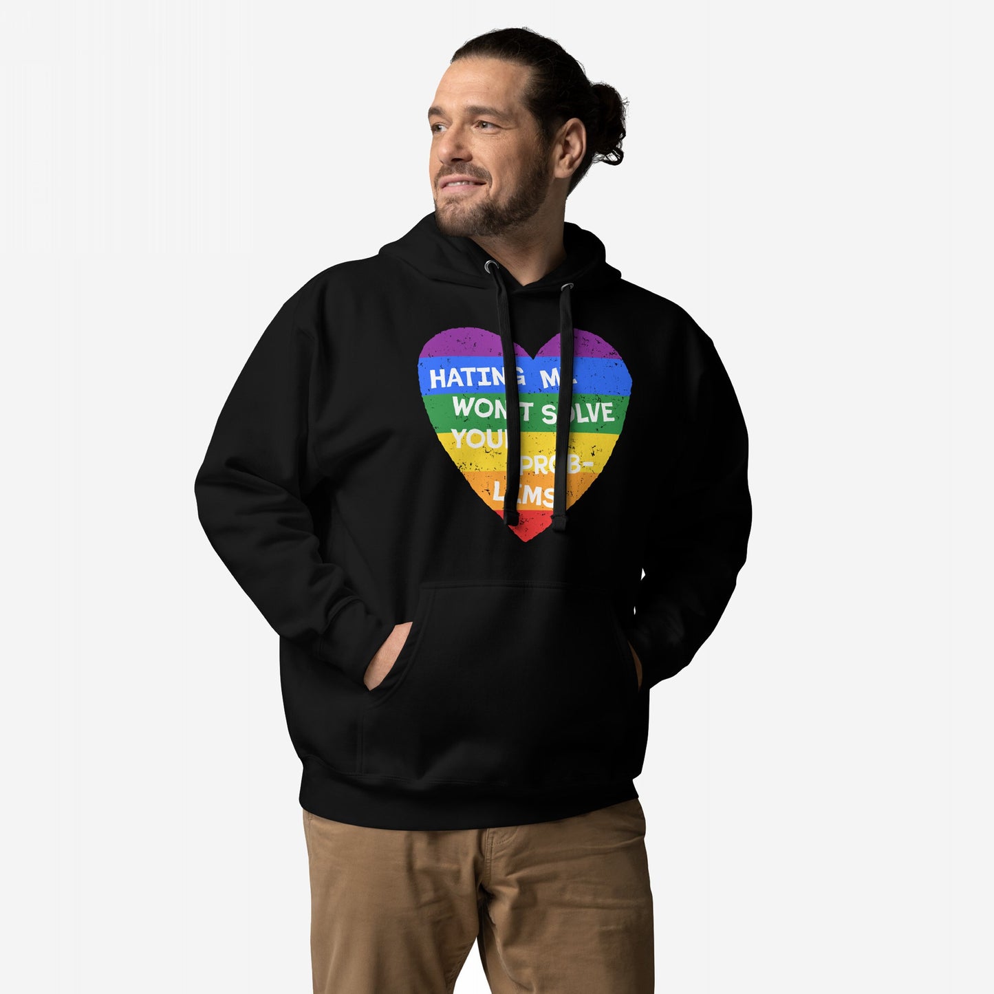Man in No LGBTQ Hate Hoodie featuring a rainbow heart graphic and text “HATING ME WON’T SOLVE YOUR PROBLEMS,” embodying pride and resistance in collaboration with EGOPROOF, hands in front pocket.