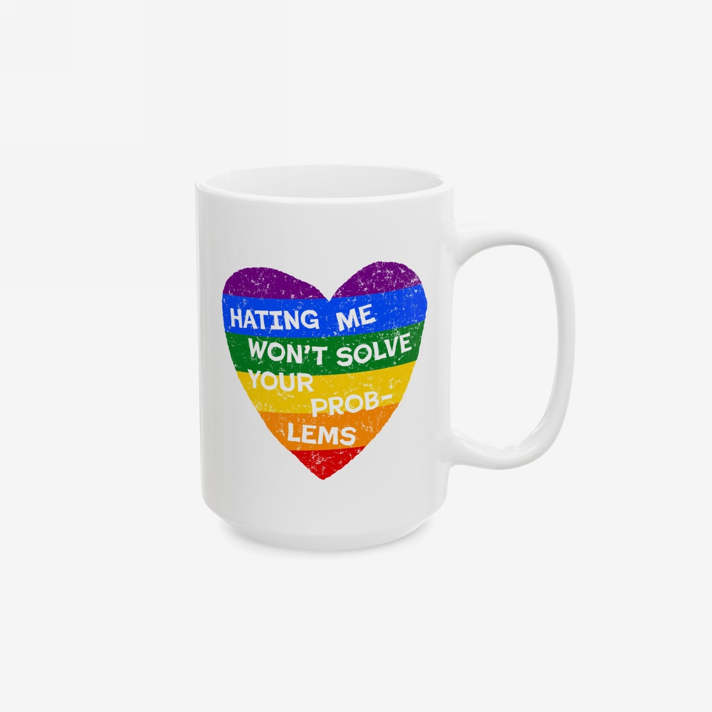 No LGBTQ Hate Mug featuring a distressed rainbow heart with the bold slogan “HATING ME WON’T SOLVE YOUR PROBLEMS,” showcasing pride and resilience on a white ceramic mug.