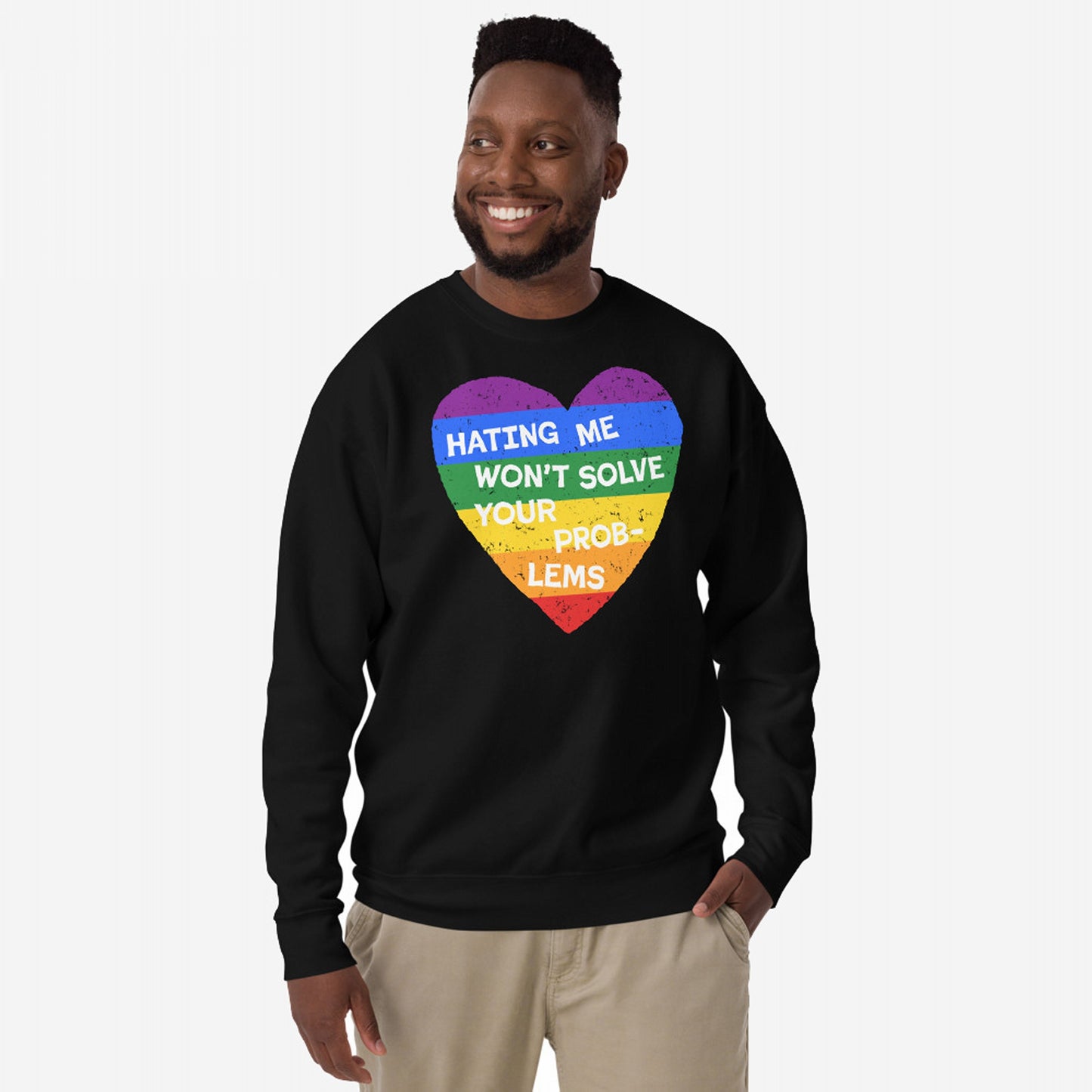 Man wearing the No LGBTQ Hate Hoodie & Sweatshirt with a rainbow-striped heart and bold text, HATING ME WON'T SOLVE YOUR PROBLEMS, embodying pride and resistance.