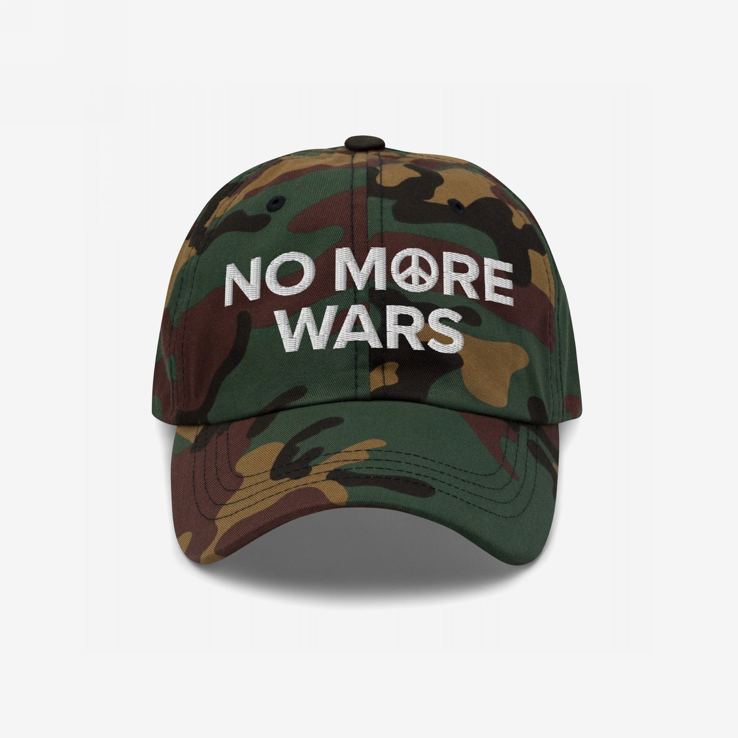 No More Wars Hat featuring a camouflage pattern and a bold 'NO MORE WARS' embroidery with a peace symbol. This cap embodies a strong anti-war stance, perfect for protests and everyday wear.