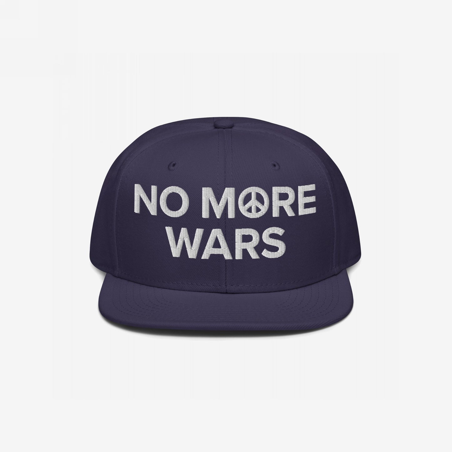 Dark-blue snapback hat with NO MORE WARS slogan, featuring a peace symbol in the O. Embroidered for anti-war advocacy, aligning with the store's commitment to equality and social justice.