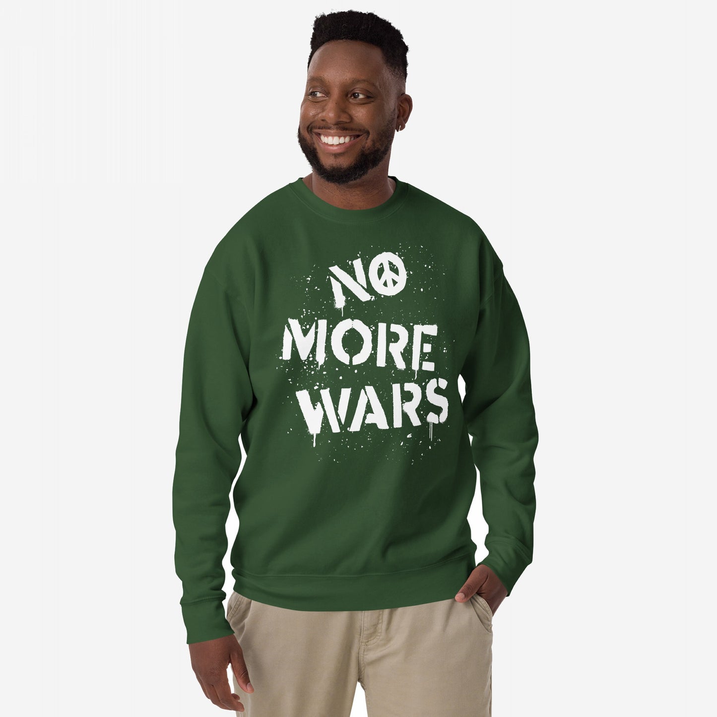 No More Wars Sweatshirt featuring a peace symbol and protest slogan worn by a smiling man with a friendly expression, embodying a call for global peace and activism.