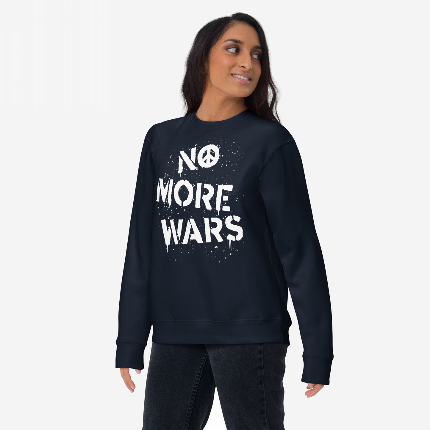 Woman wearing No More Wars Sweatshirt with bold, white stencil-style lettering and peace symbol. The design embodies a protest message against global violence, reflecting the store's advocacy for peace and equality.