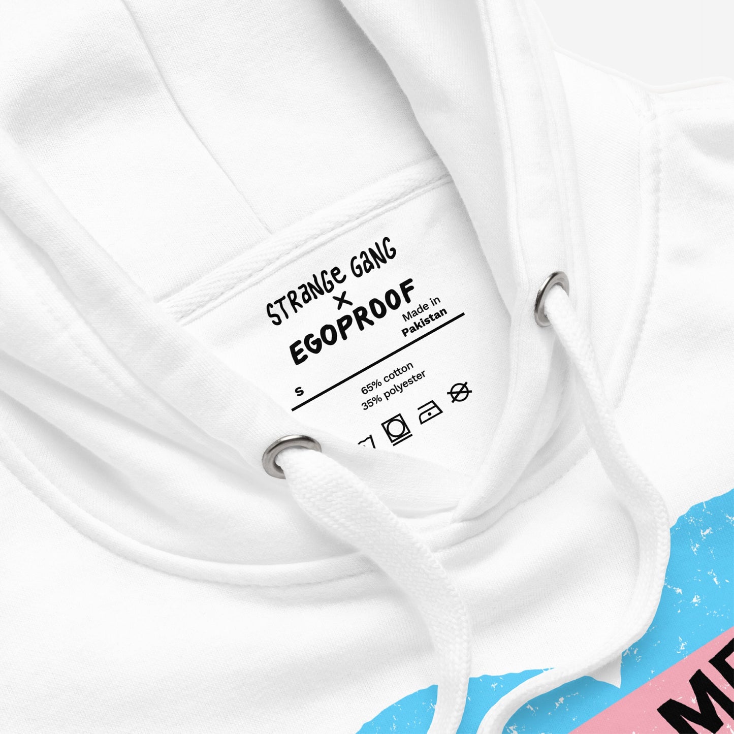 No Trans Hate Hoodie & Sweatshirt featuring a close-up of the hood area, showing STRANGE GANG × EGOPROOF label and drawcords. Edge of trans flag graphic visible, symbolizing resilience and solidarity.