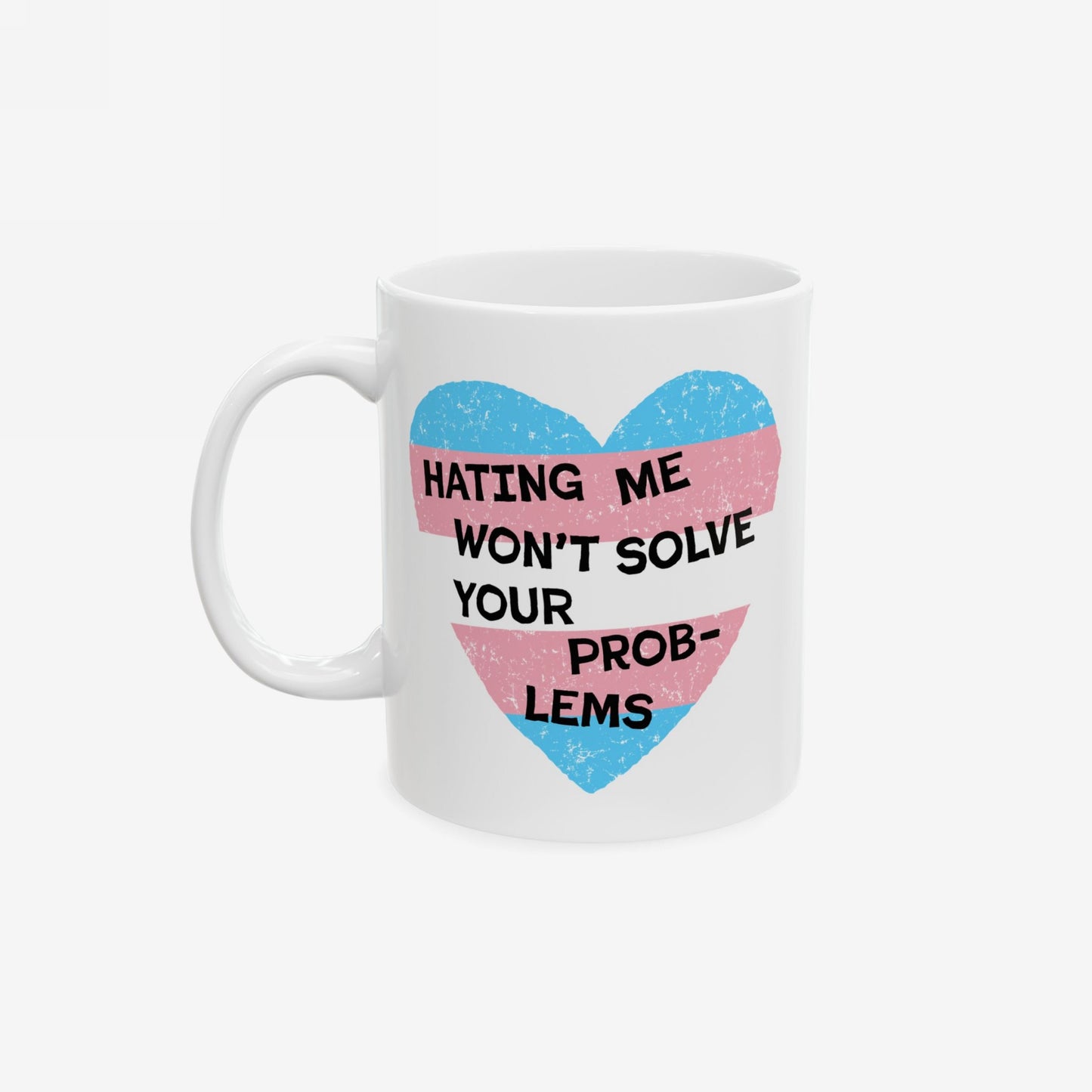 The No Trans Hate Mug features a heart in trans flag colors with the slogan Hating Me Won’t Solve Your Problems, embodying strength and support for LGBTQ+ pride and solidarity.