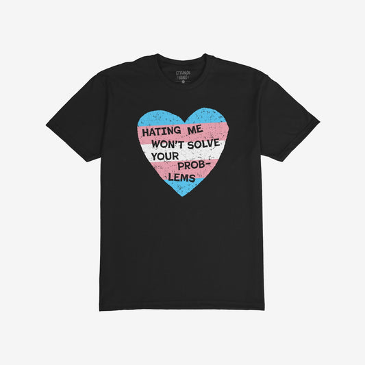No Trans Hate T-shirt featuring a distressed heart in trans pride colors with the slogan “HATING ME WON’T SOLVE YOUR PROBLEMS,” showcasing identity and resilience. Available in various styles and sizes.