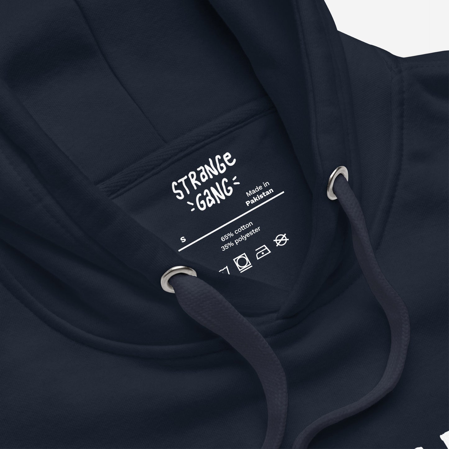 Close-up of No Oligarchy Hoodie, showing inside neck label with size S and material details. Features drawcords with metal eyelets and folded fabric around neckline.