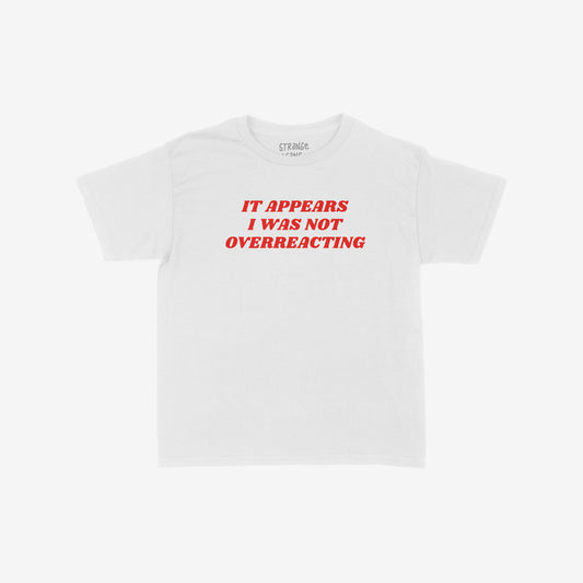 Overreacting Women's Baby Tee with bold red text: “It appears I was not overreacting.” A statement piece for those challenging oppression and silencing, reflecting a commitment to equality and political activism.