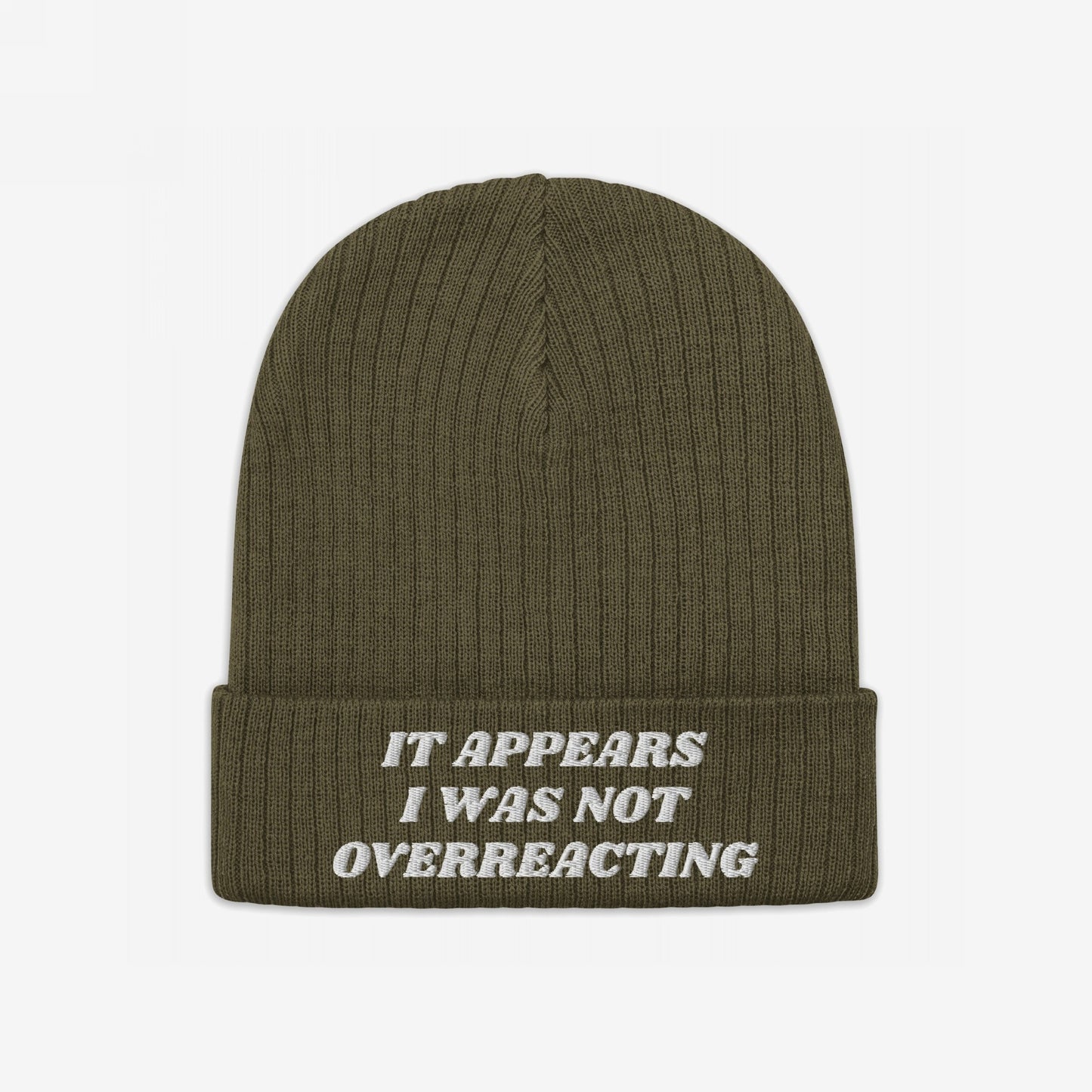 The No More Wars Hat features an olive-green knit beanie with a folded cuff, embroidered with the anti-war message “It appears I was not overreacting.” Perfect for protests and everyday wear.