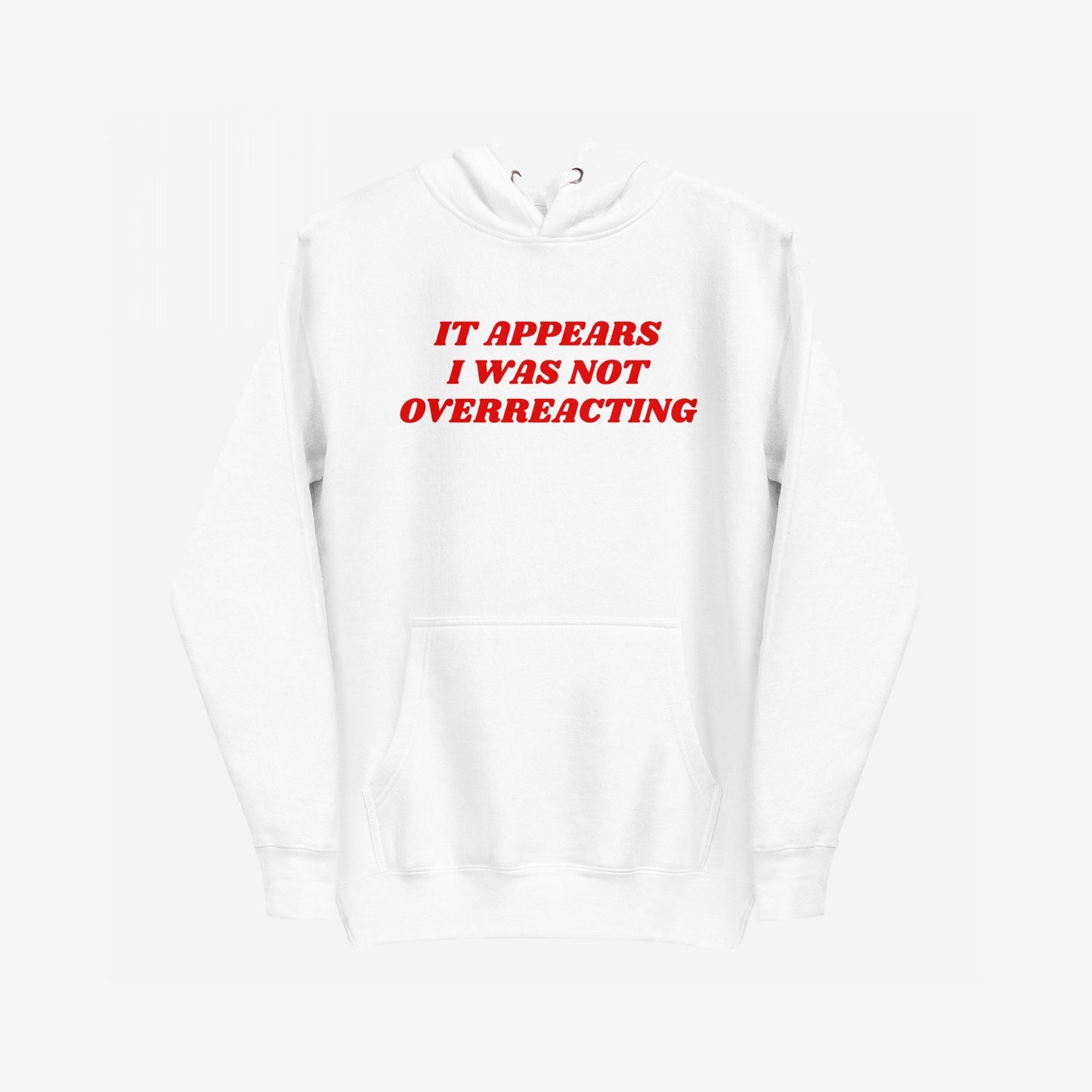Overreacting Hoodie & Sweatshirt features bold red text declaring, “IT APPEARS I WAS NOT OVERREACTING.” This plain white pullover embodies resistance, advocating against oppressive systems with its striking message.