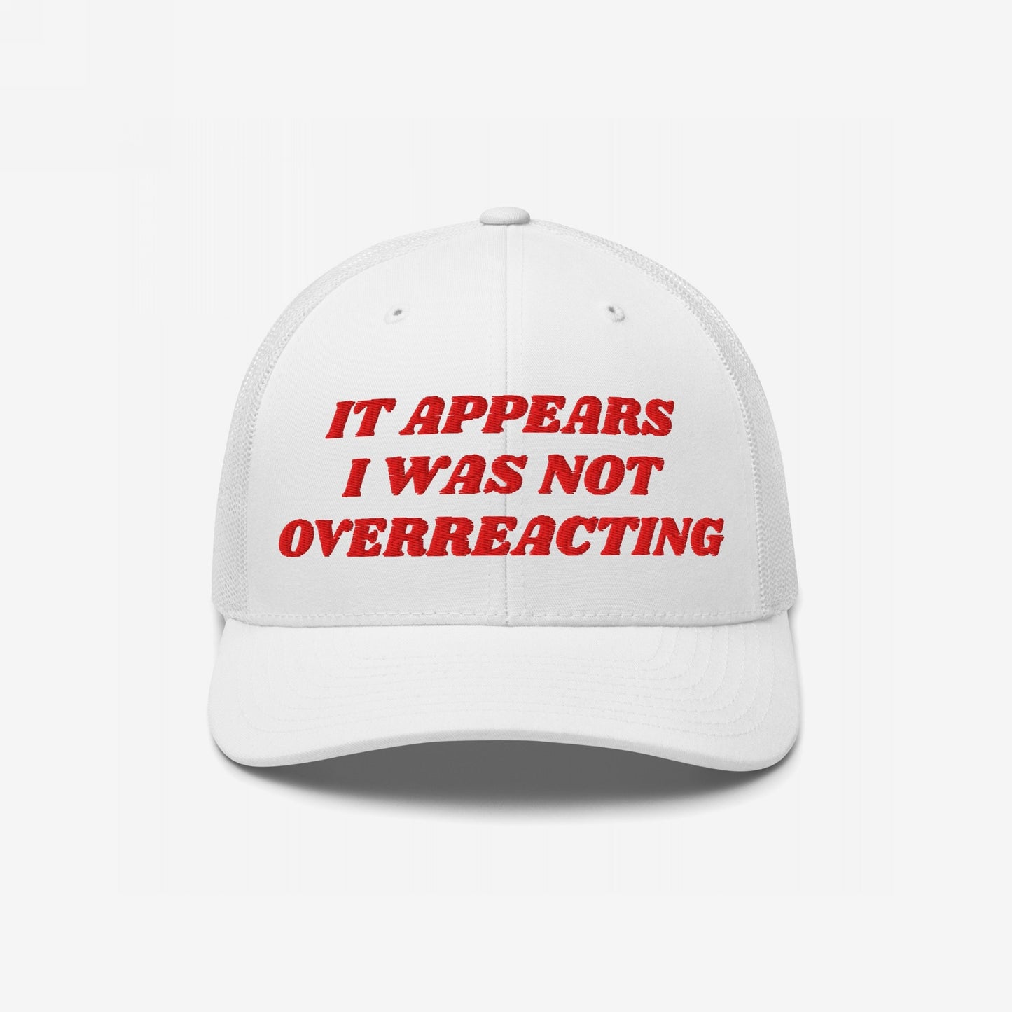 White mesh-back baseball cap with bold red embroidery reading “IT APPEARS I WAS NOT OVERREACTING,” embodying defiance against political gaslighting, perfect for activists and truth-tellers.