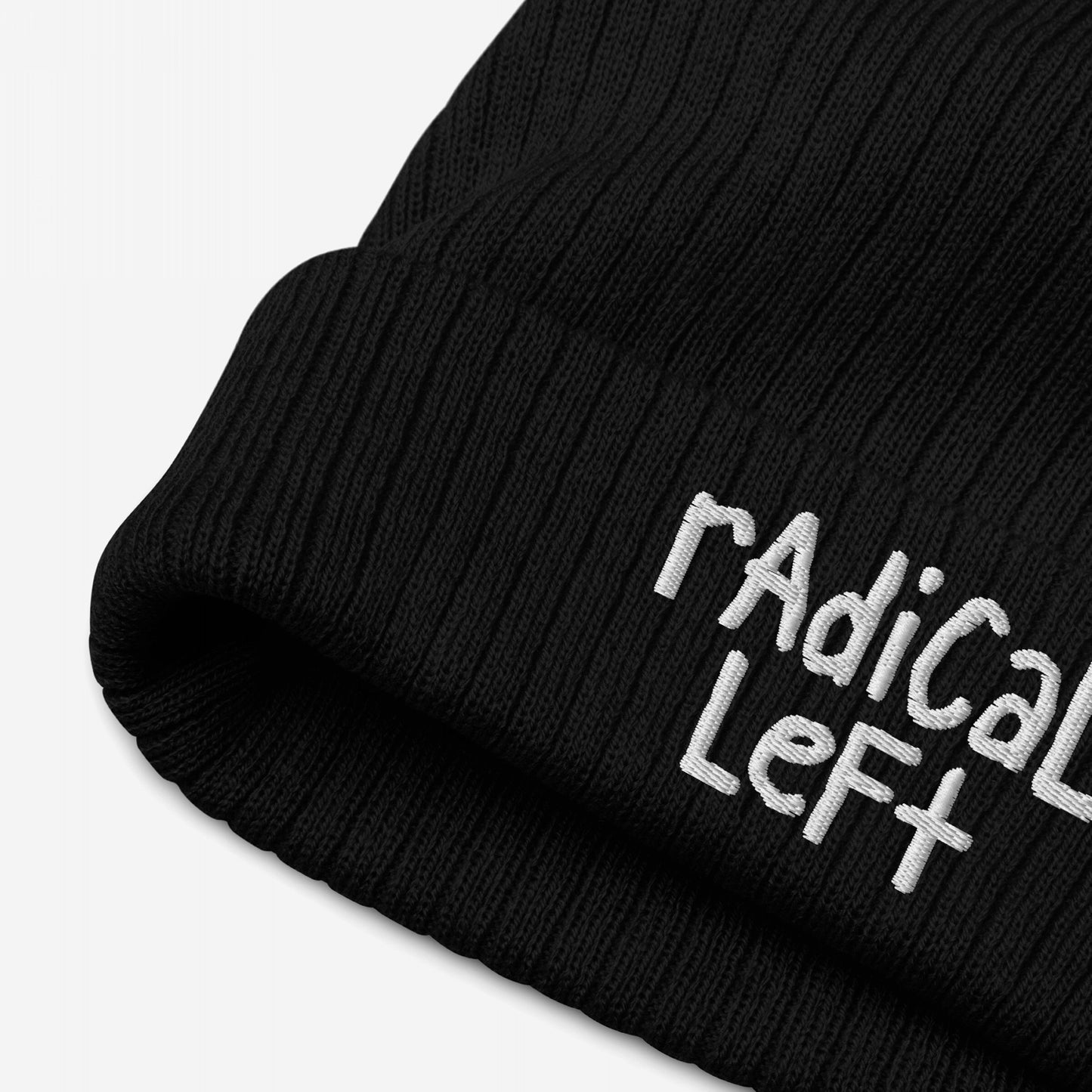 Black rib-knit beanie with Radical Left in white embroidery on the cuff, embodying progressive values and defiance.