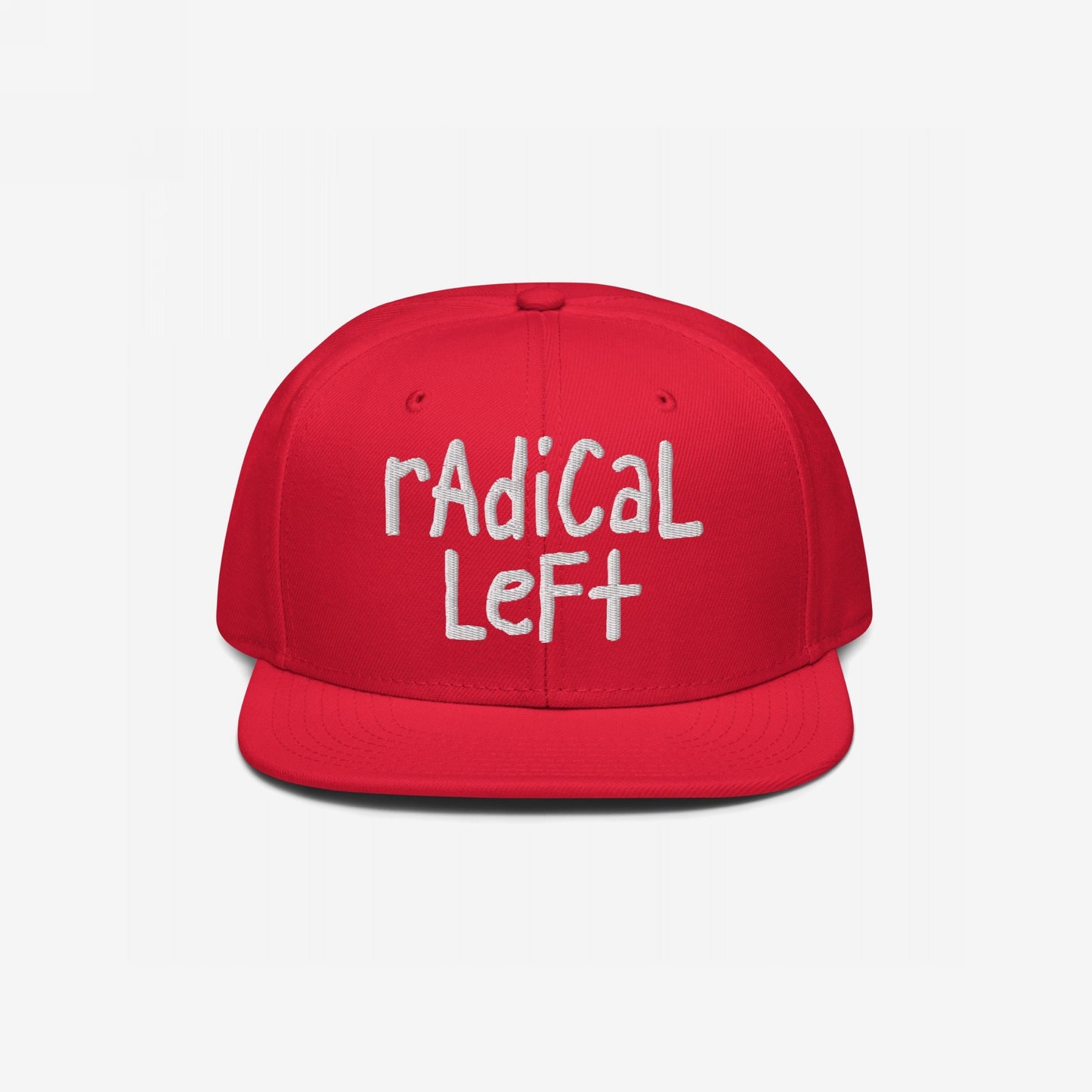 Red flat-brimmed Radical Left Hat with “rADiCaL LeFt” embroidered in white, embodying progressive ideals and defiance against fearmongering. Available in various styles, supporting Amnesty International.