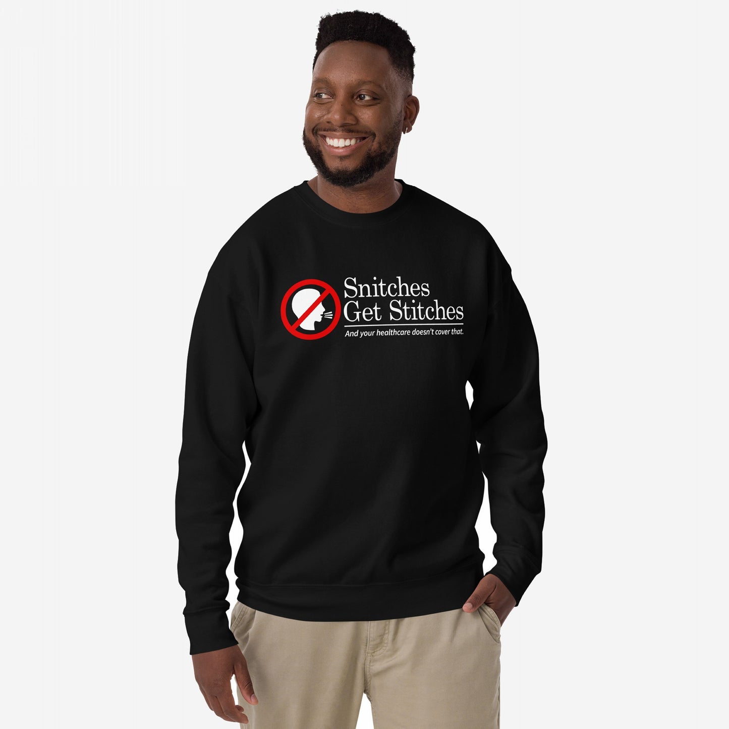 Man wearing Snitches Get Stitches Hoodie & Sweatshirt, featuring a bold graphic of a crossed-out silhouette and text highlighting betrayal and healthcare issues, against a plain background, embodying dark humor and honesty.