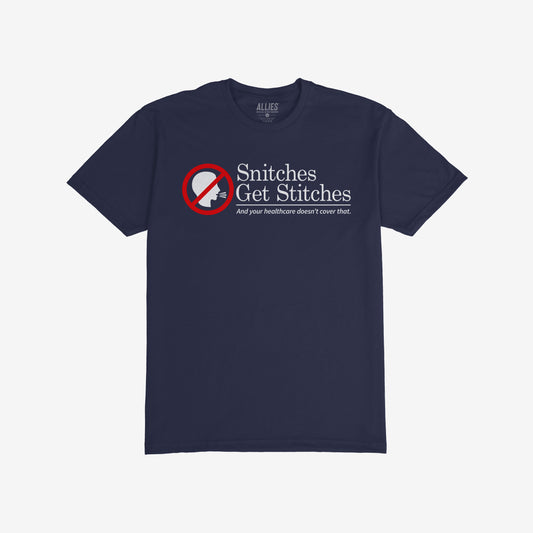 Dark navy-blue T-shirt featuring Snitches Get Stitches slogan, humorously critiquing healthcare with a “no talking” icon, reflecting bold, unapologetic values.