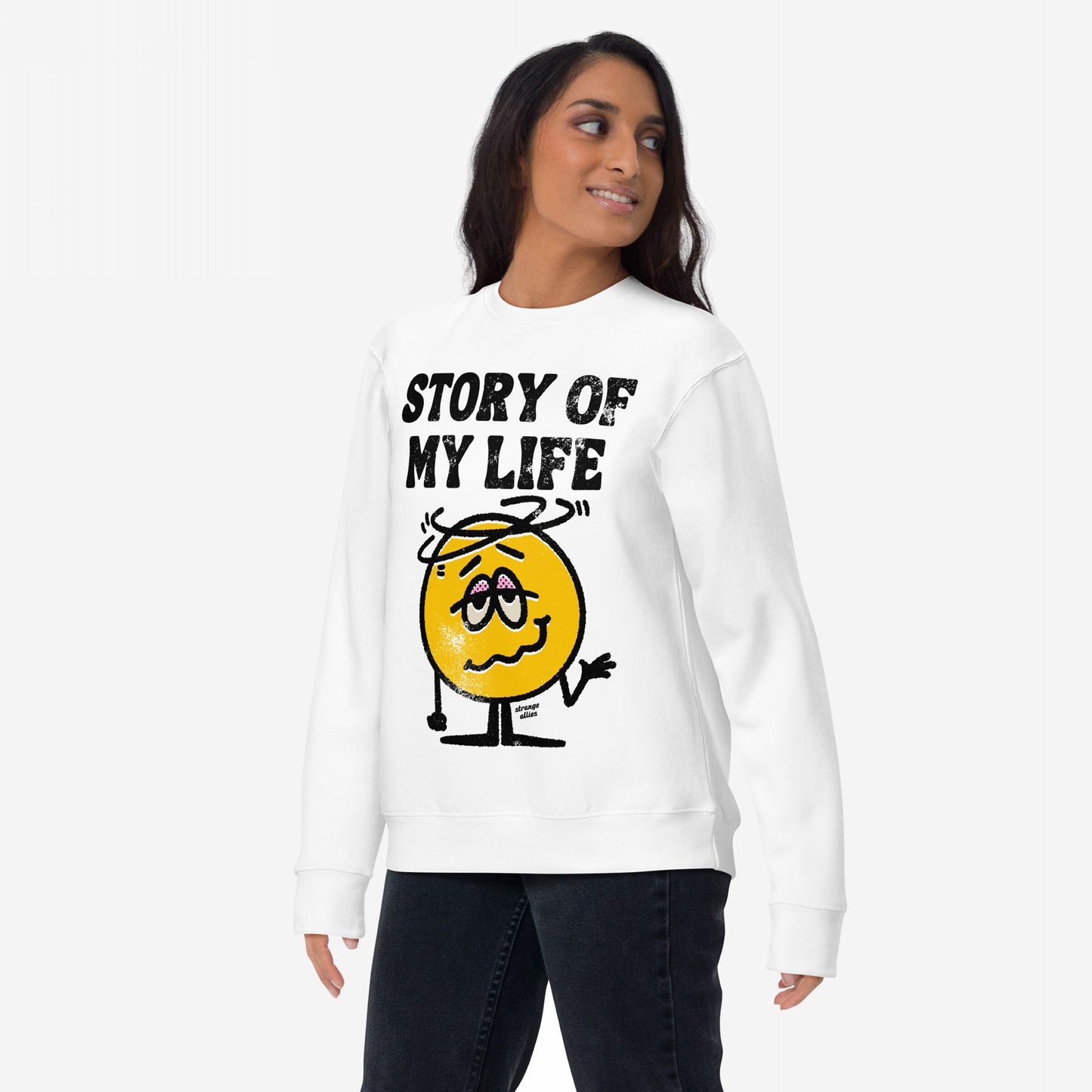Story Of My Life Sweatshirt featuring a cartoonish dizzy face and bold text, embodying daily chaos with humor. Modeled casually, it symbolizes resilience and style for those embracing life's mishaps.