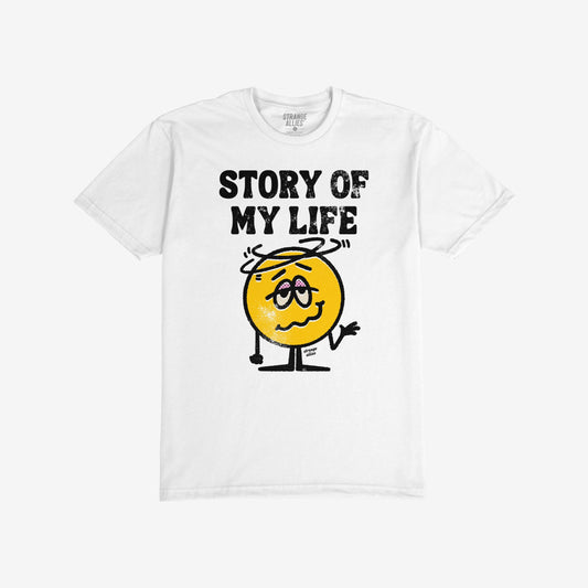 Story Of My Life T-shirt featuring distressed STORY OF MY LIFE text and a cartoonish woozy emoji with a halo, capturing a humorous sense of defeat. Brand name subtly in the collar.