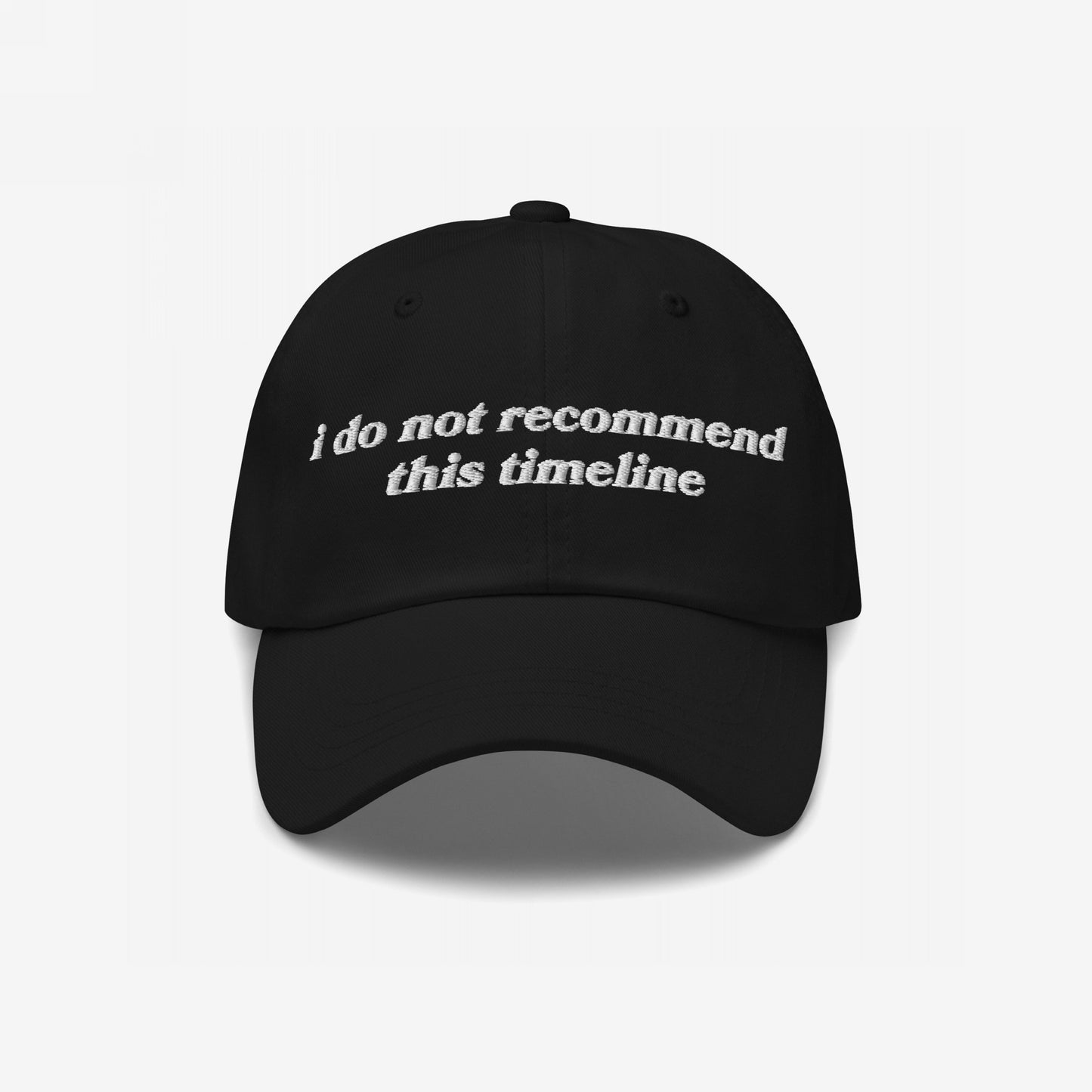 The Timeline Hat features i do not recommend this timeline in white vintage-inspired embroidery, ideal for expressing political discontent and sarcasm. Suitable for protest-walking or surviving absurdity.