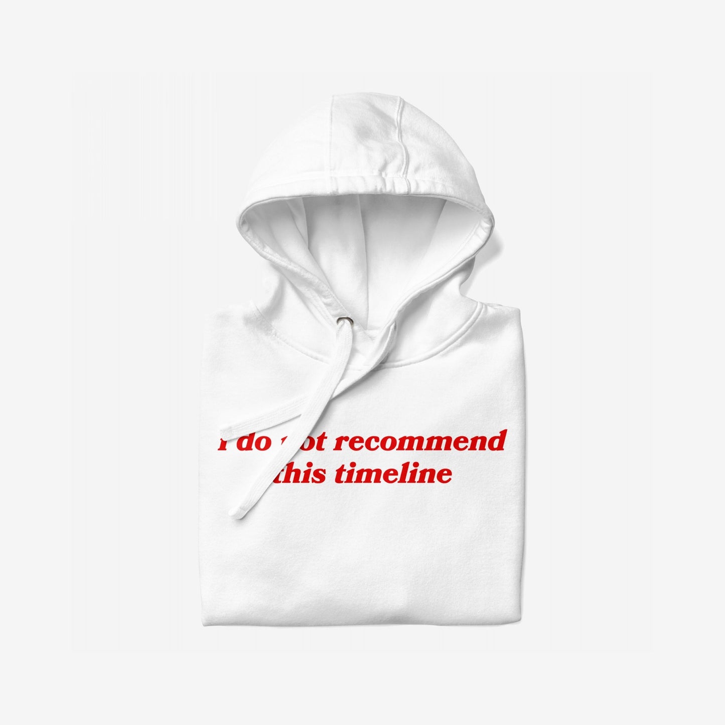 The Timeline Hoodie & Sweatshirt features a white pullover with a bold red slogan, I do not recommend this timeline, emphasizing dry wit and dystopian fashion with minimalist, sarcastic flair.