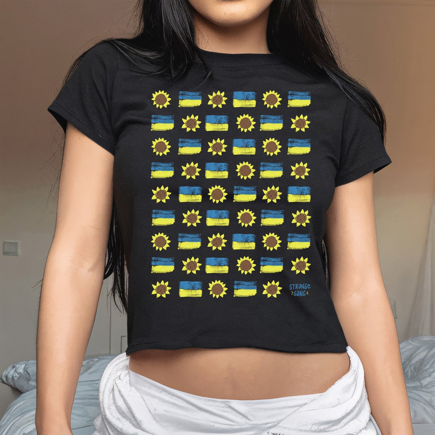 Ukraine Sunflowers Women's Baby Tee featuring a grid of stylized sunflowers and Ukrainian flags, symbolizing resilience and hope. Ideal for allies supporting peace and Ukraine's strength.