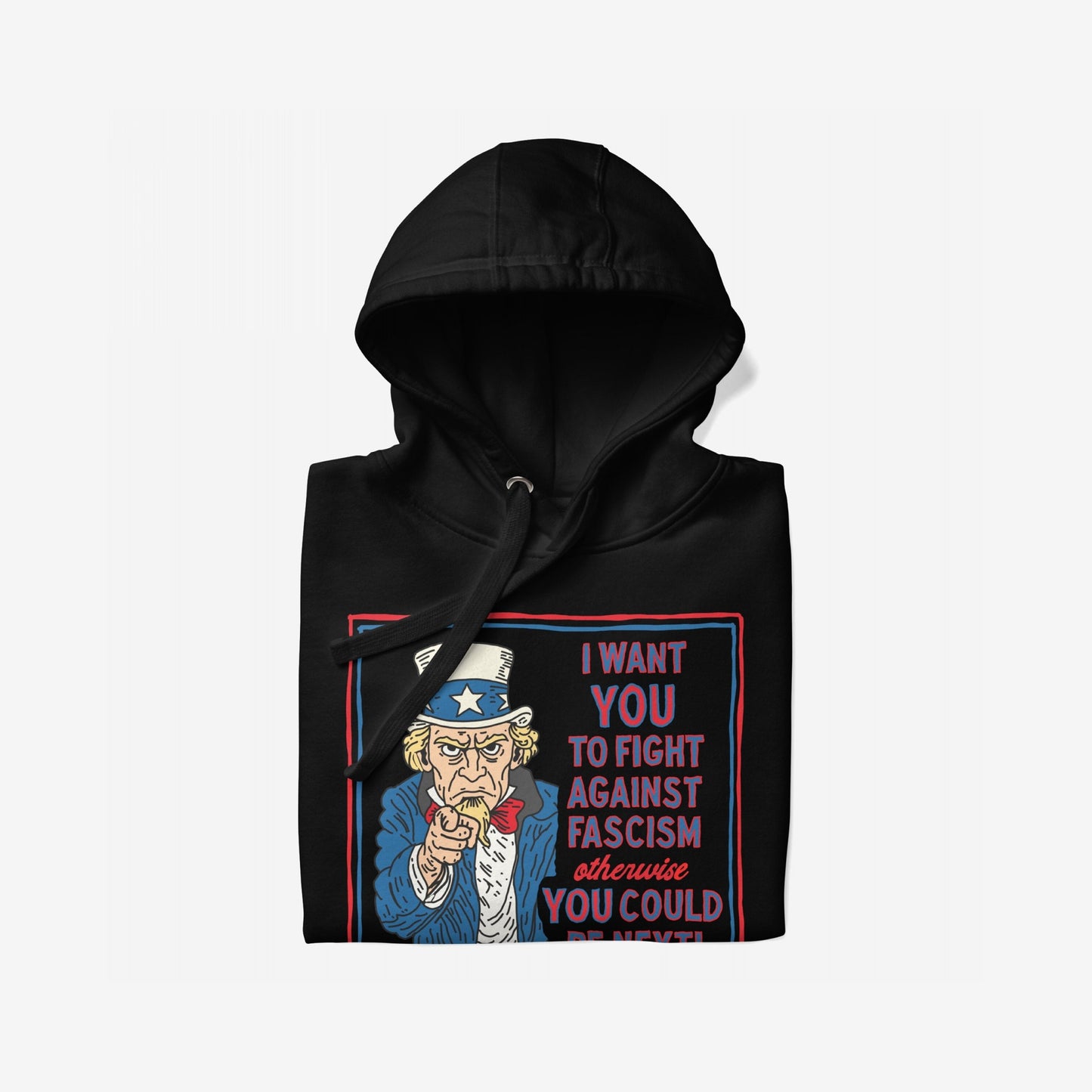 Anti-Fascist Uncle Sam Hoodie featuring a bold Uncle Sam graphic urging to fight fascism. The design, with red-and-blue text, highlights activism and resistance on a neatly folded black sweatshirt.