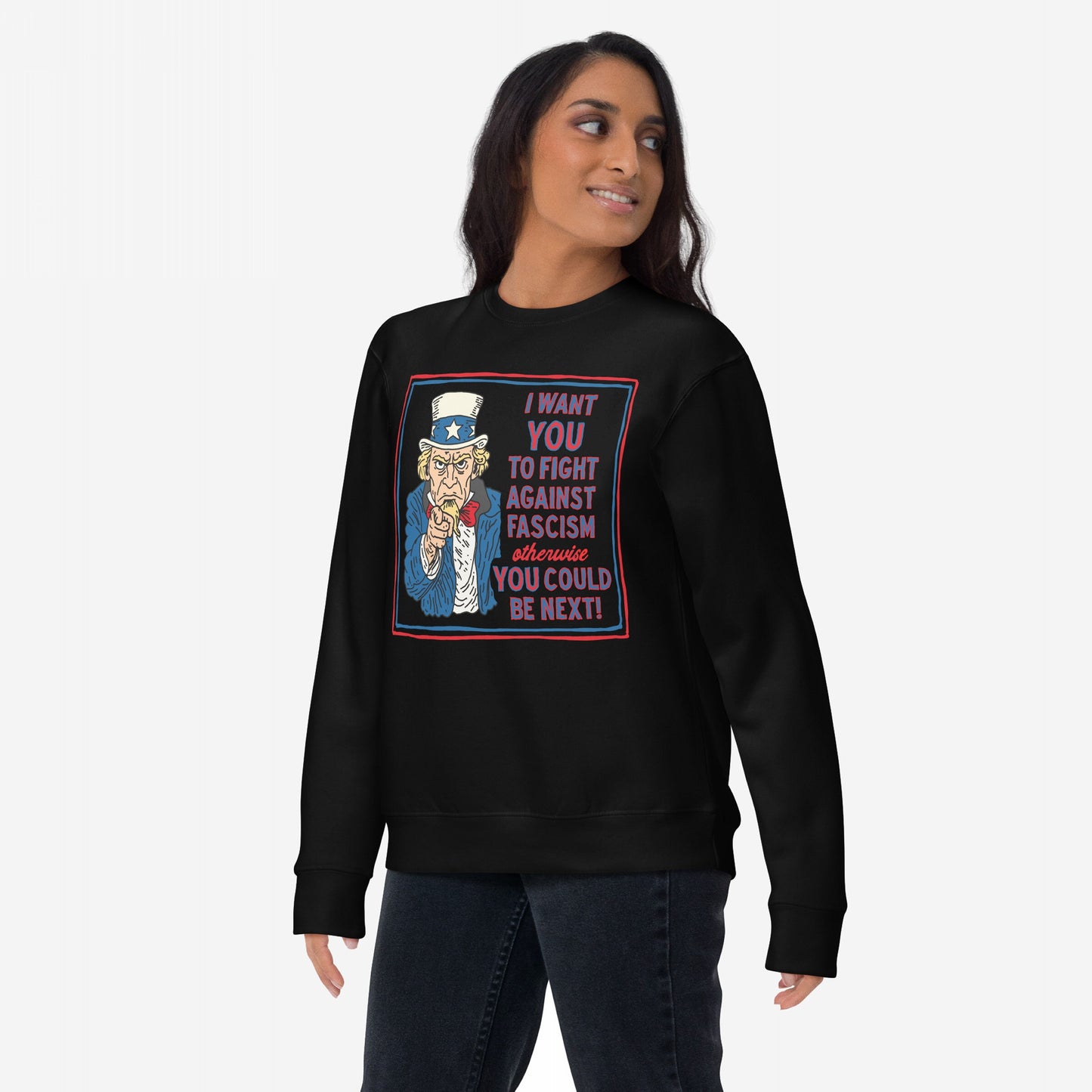 A young woman models the Anti-Fascist Uncle Sam Hoodie & Sweatshirt, featuring a bold Uncle Sam graphic urging resistance against fascism with a powerful message in red and blue text.