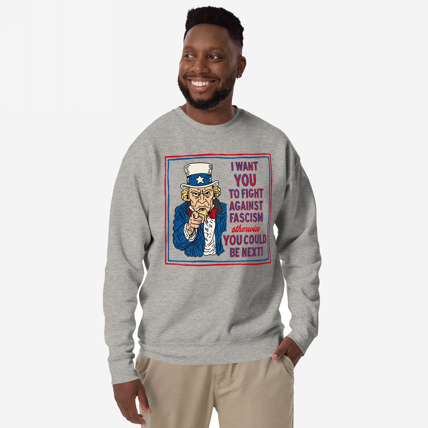 Anti-Fascist Uncle Sam Hoodie & Sweatshirt featuring a bold Uncle Sam graphic urging to fight fascism, worn by a smiling man with dark hair and beard, embodying activism and resistance.