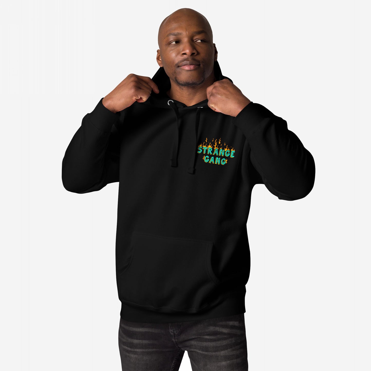 Male model wearing Your Favorite Band Has Always Been Political Hoodie, featuring a green flame logo on the chest, holding drawstrings. The design embodies political engagement and musical activism.