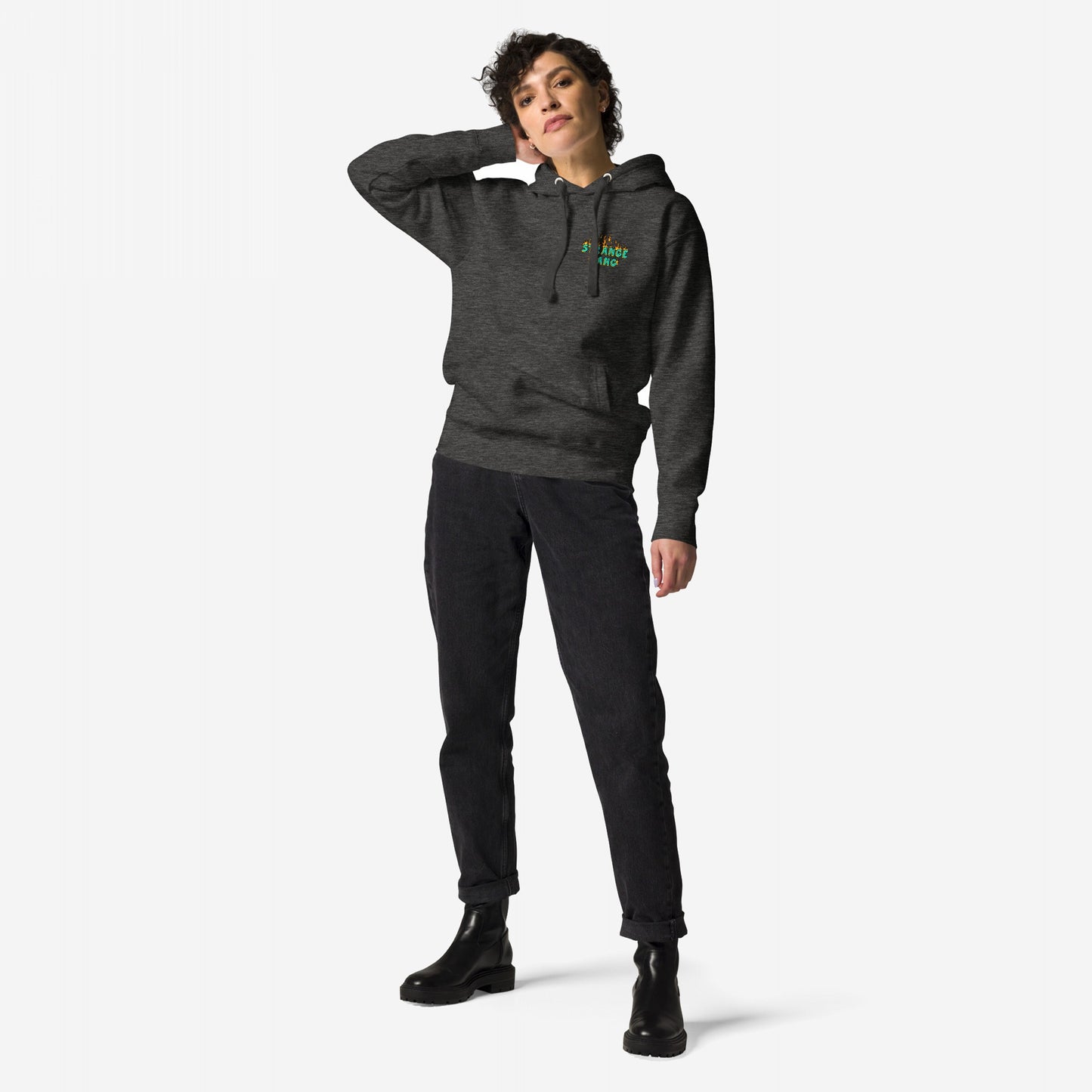 Model wearing the Your Favorite Band Has Always Been Political Hoodie, featuring a subtle chest logo, paired with high-waisted black jeans and chunky ankle boots, embodying a bold, rebellious aesthetic.