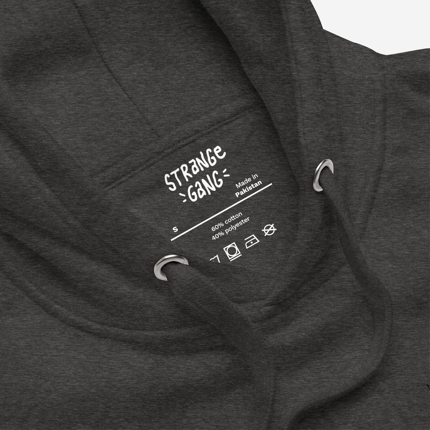 Close-up of Your Favorite Band Has Always Been Political Hoodie & Sweatshirt label, showing size S, made in Pakistan, 60% cotton, 40% polyester, with laundry symbols and hood's drawcord eyelets visible.