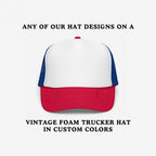 Foam Trucker Hat In Custom Colors featuring a red bill, white foam front, and blue mesh panels. Customize with anti-fascist or anti-racist designs, perfect for showcasing your values with vintage style.