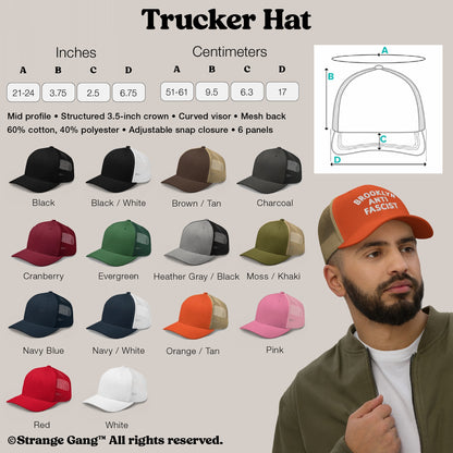 Trucker Hat In Custom Colors: Mid-profile cap with structured crown, curved visor, and mesh back. Adjustable snap closure. Model wears orange front with tan mesh, featuring BROOKLYN ANTI FASCIST text.